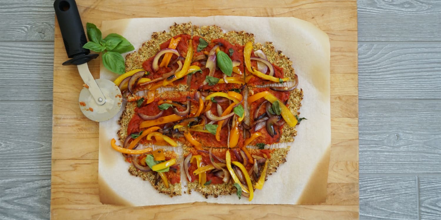 Make an easy vegan cauliflower crust for a pizza packed with veggies