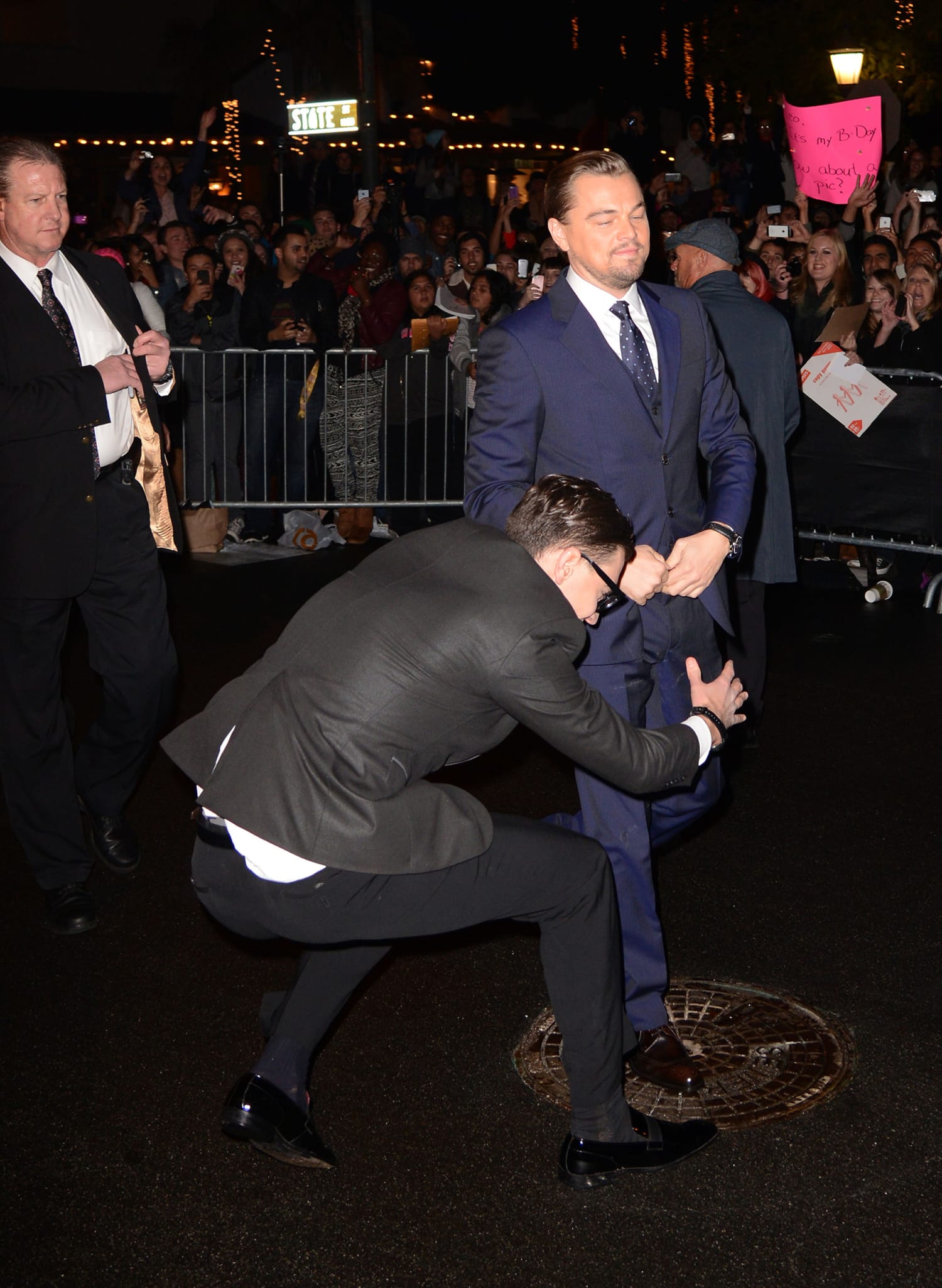 Justin Timberlake is TACKLED by a man who grabs his leg after he arrived to Louis  Vuitton show