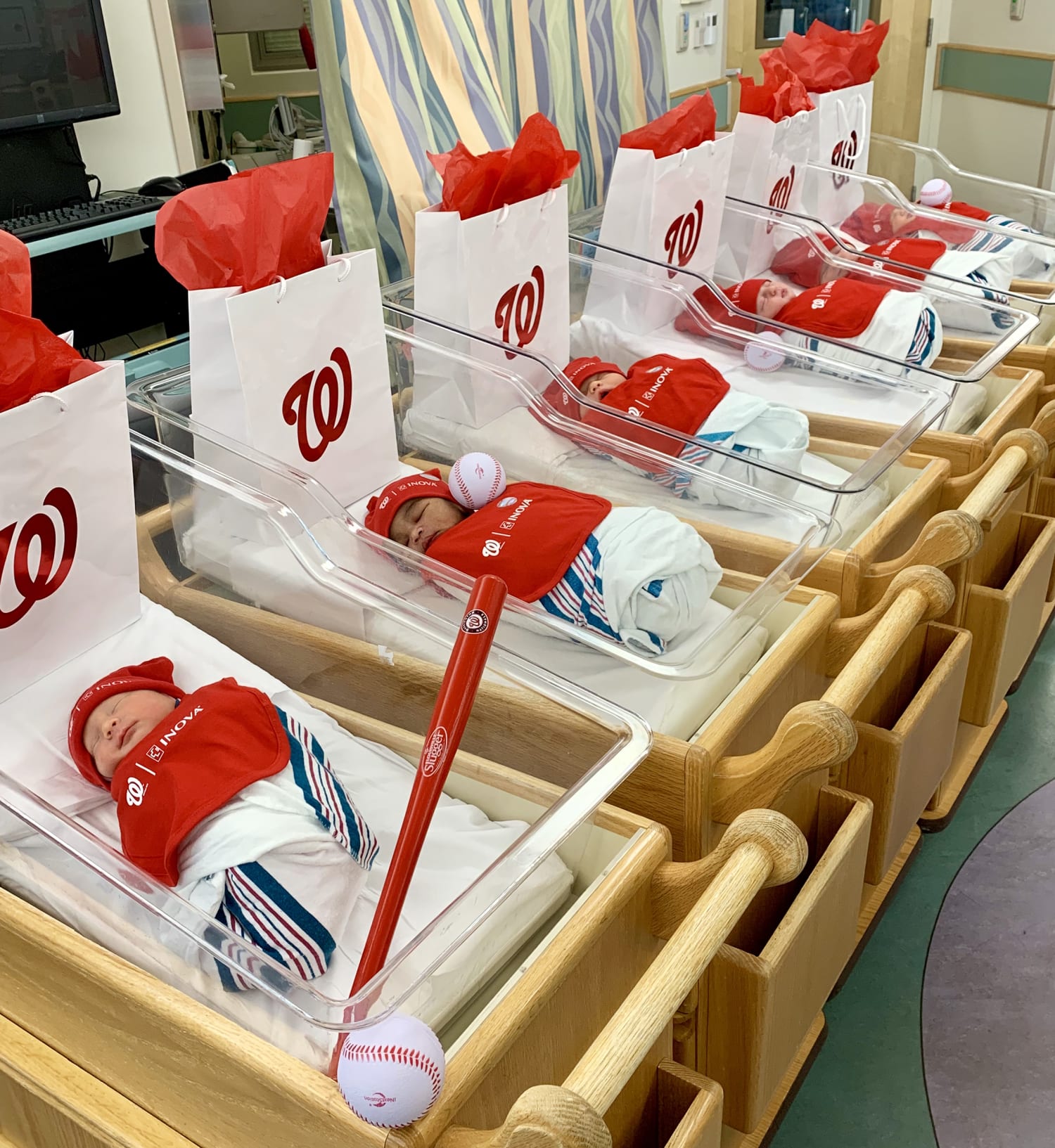 Newborns dress in Washington Nationals gear during World Series