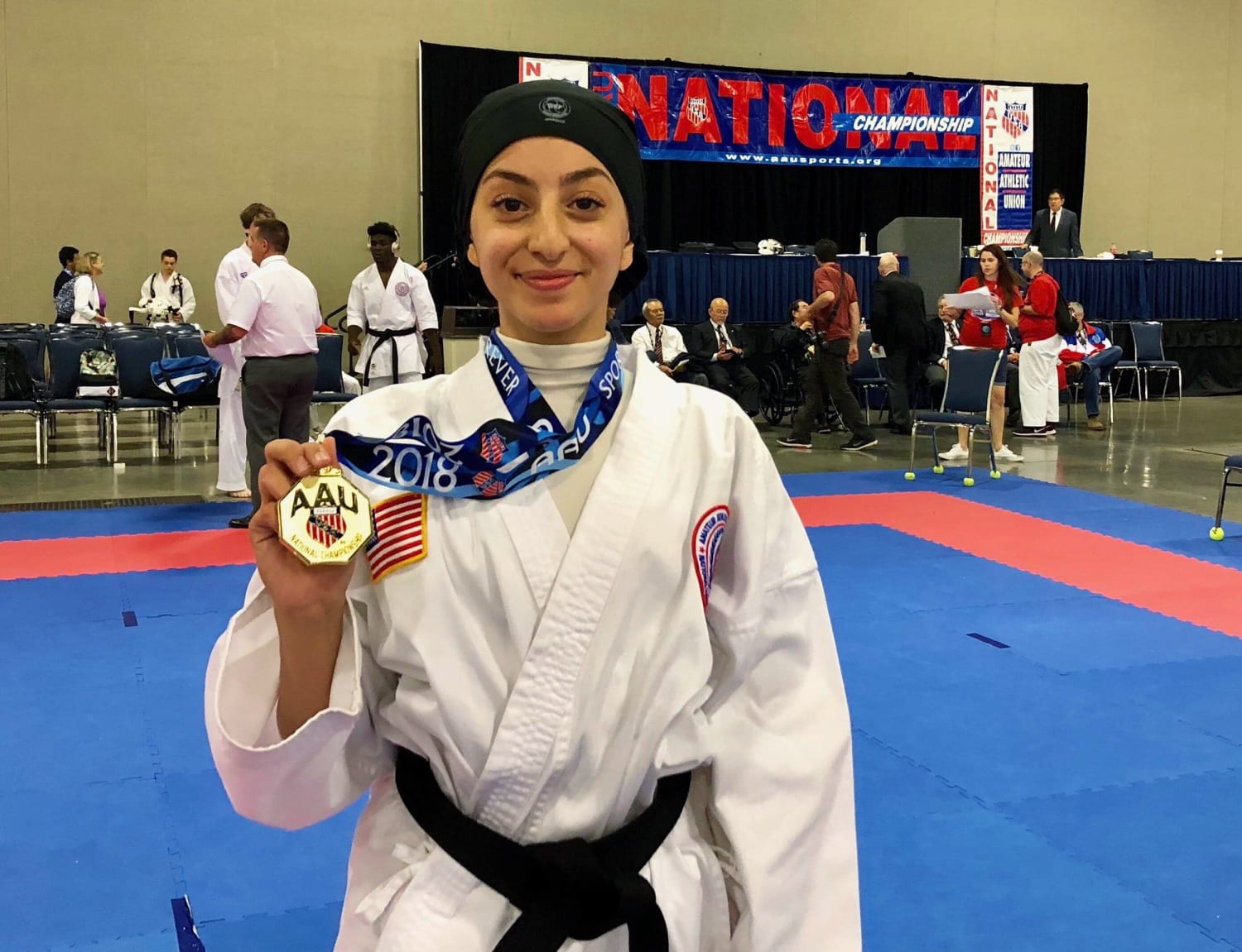 Breaking bias barriers 17-year old karate champion competes in a hijab picture