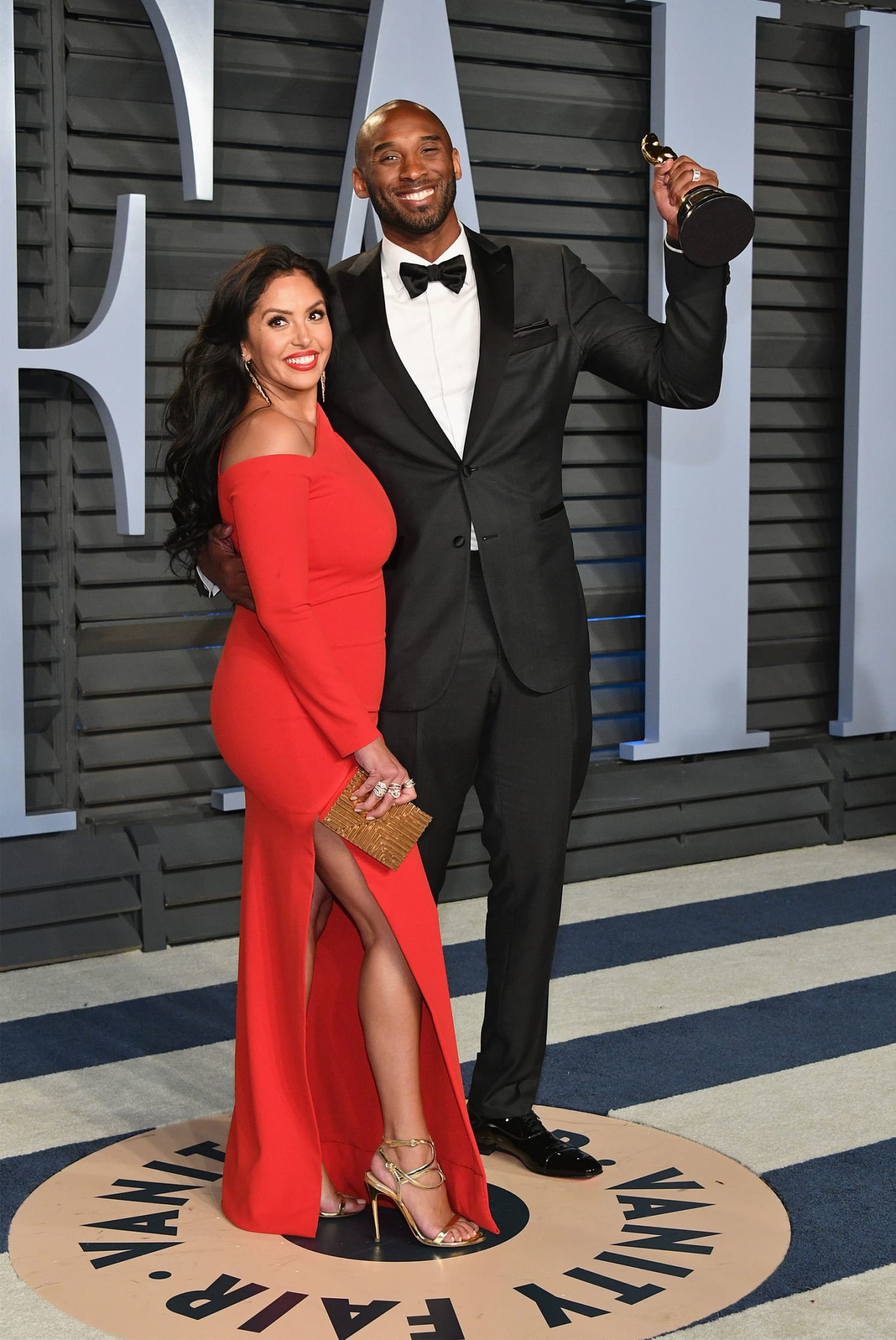 Kobe Bryant dons dapper teal suit as wife Vanessa wears matching green