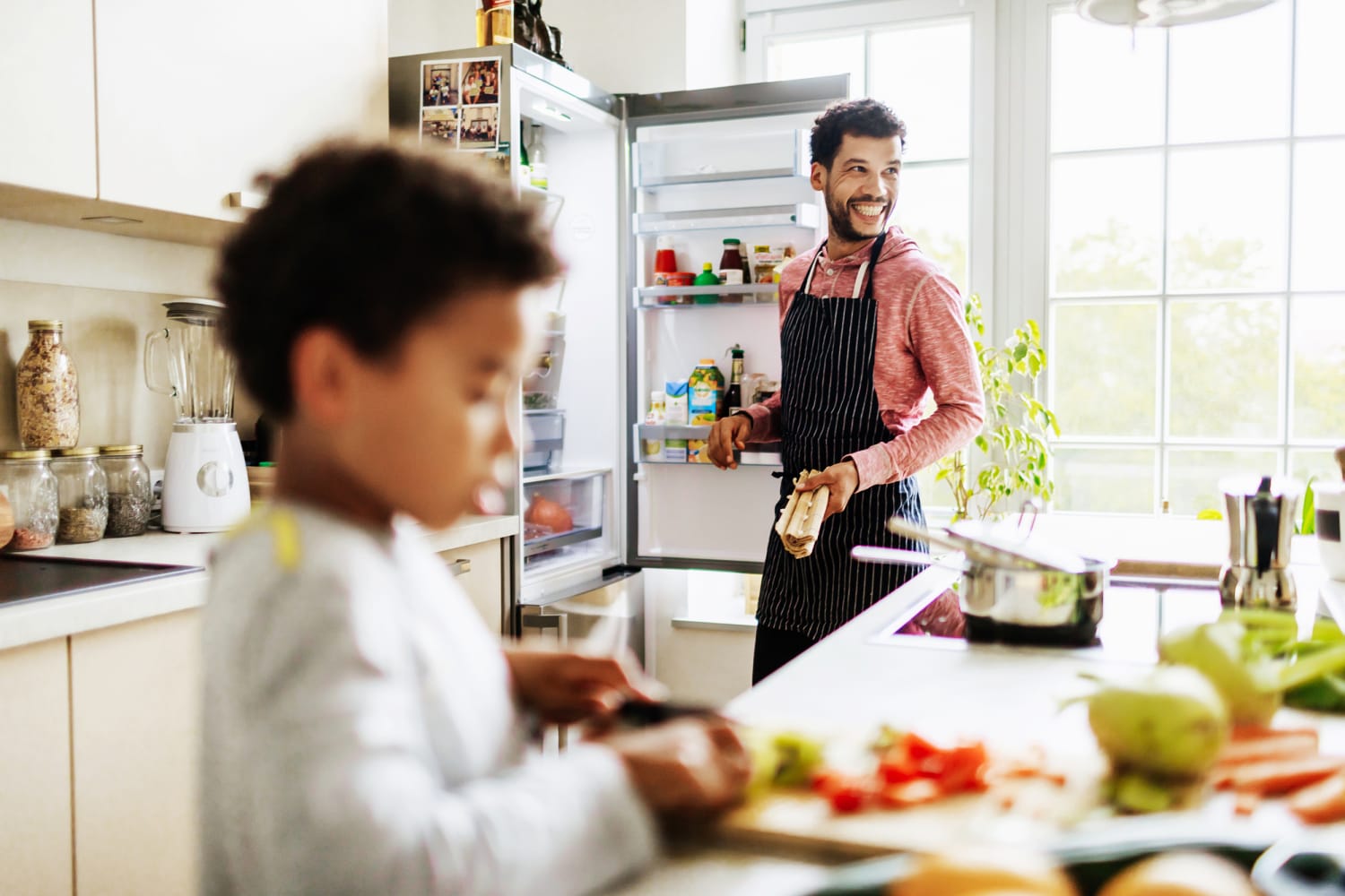 https://media-cldnry.s-nbcnews.com/image/upload/newscms/2020_41/3418710/201008-stock-smiling-dad-son-kitchen-ac-1035p.jpg