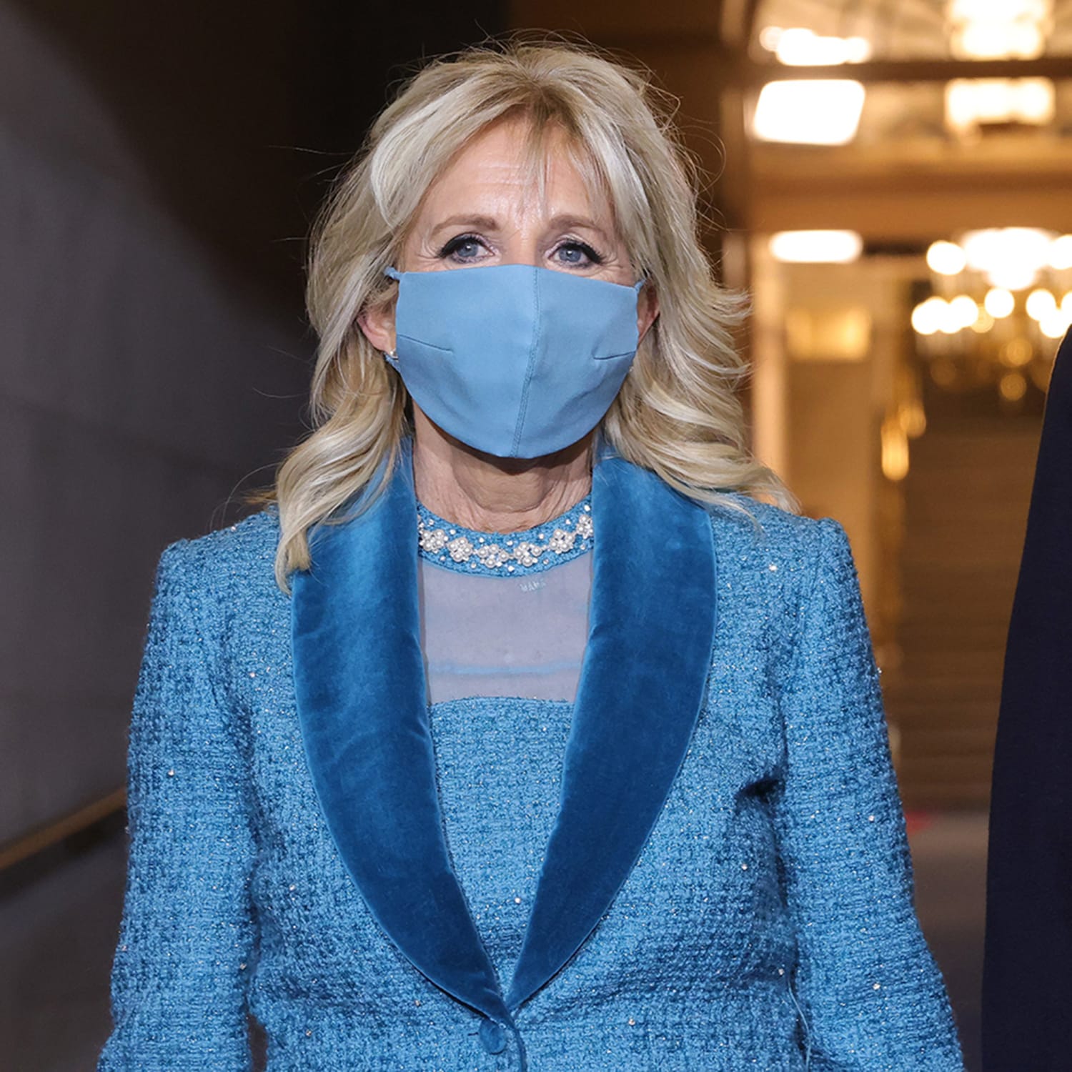 outfit is an ocean blue coat and dress 