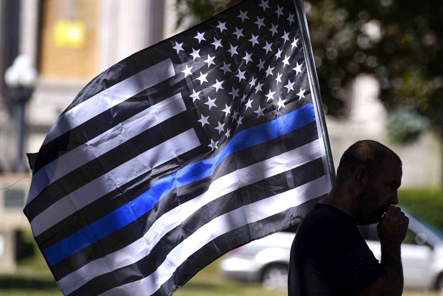 Why is the red and black flag, seen at rallies in support of