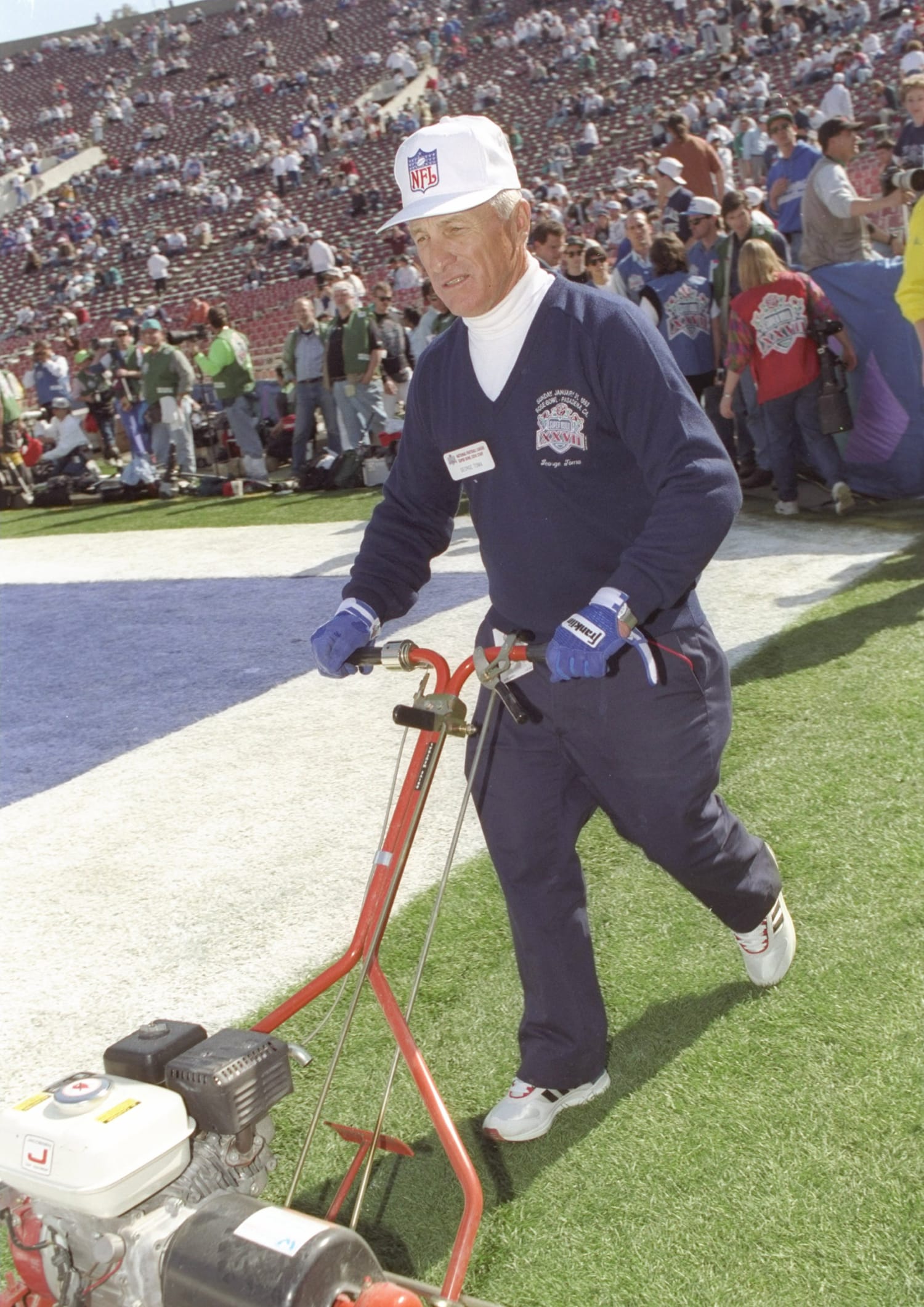 Longtime KC groundskeeper George Toma shows off his Super Bowl LIV