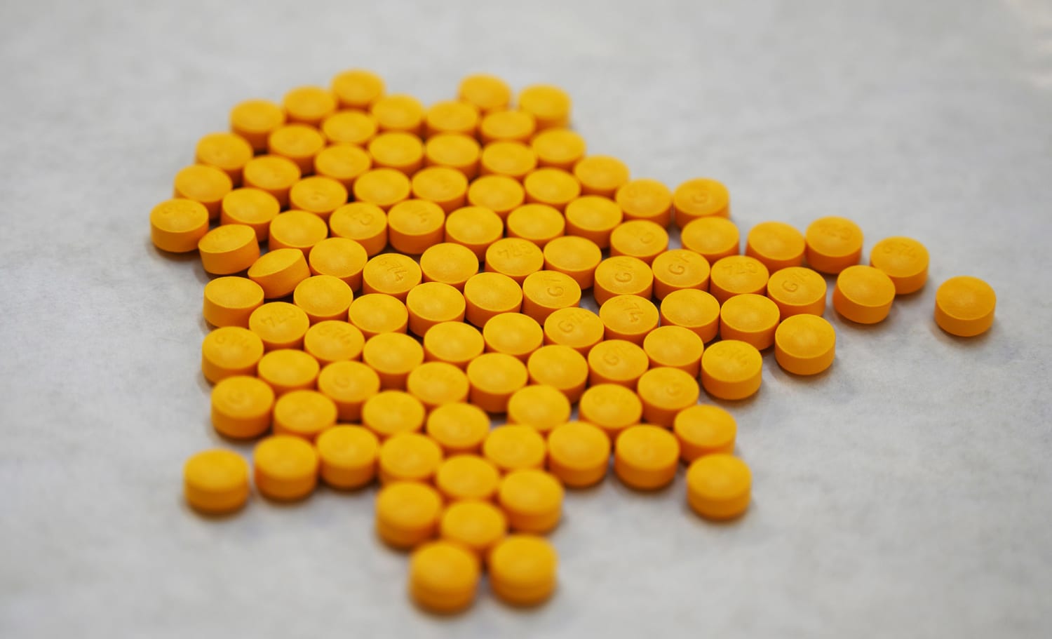 Fentanyl_Oxy_M30_bulk pills spill_2, A bag of Fentanyl lace…