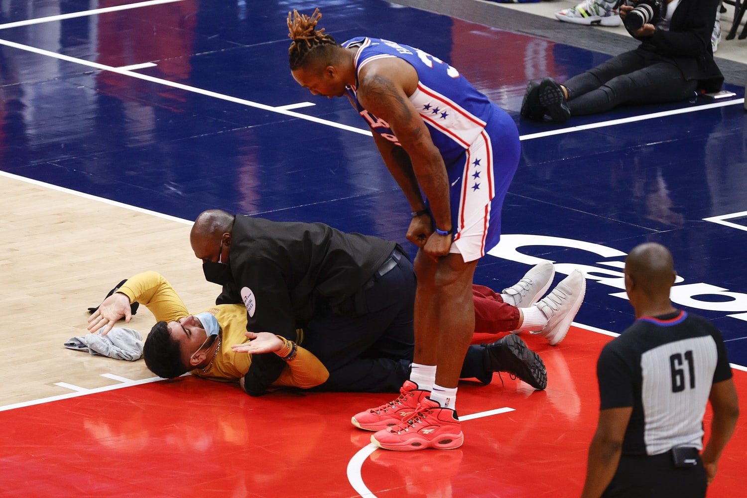 Man tackled, banned after running on court during Wizards-Sixers NBA game