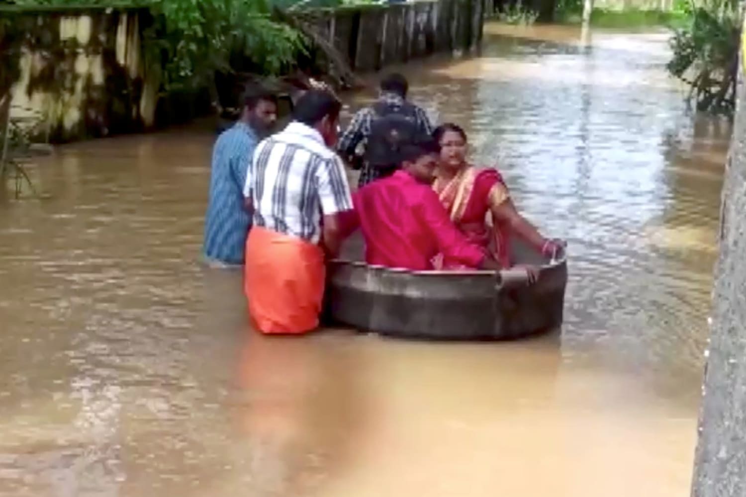 No boat, no problem: Indian bride and groom sail to flood-hit wedding in cooking pot
