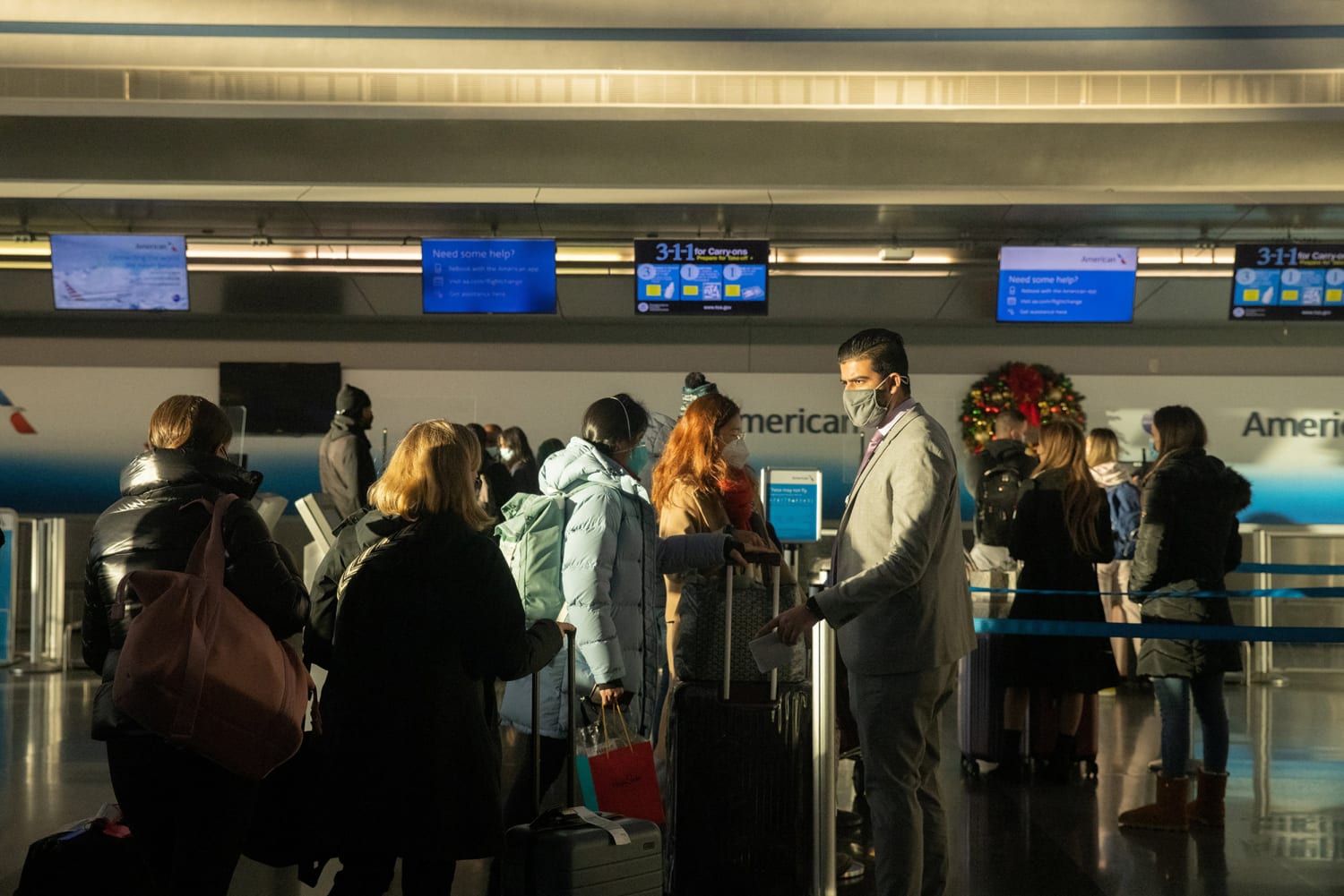 Omicron, flight cancellations hammer holiday travel