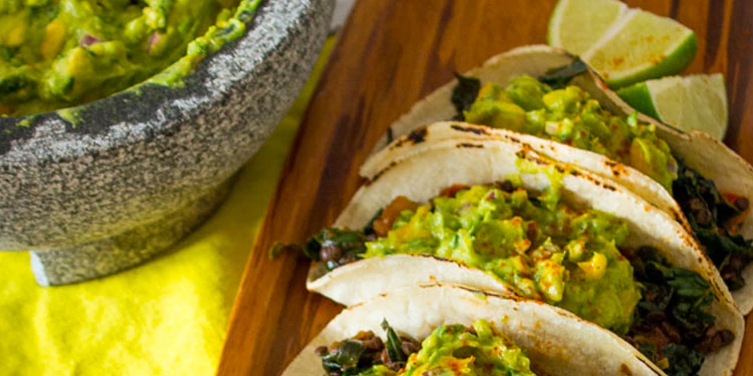 Top lentil tacos with fresh mango guacamole for a fun vegan dinner