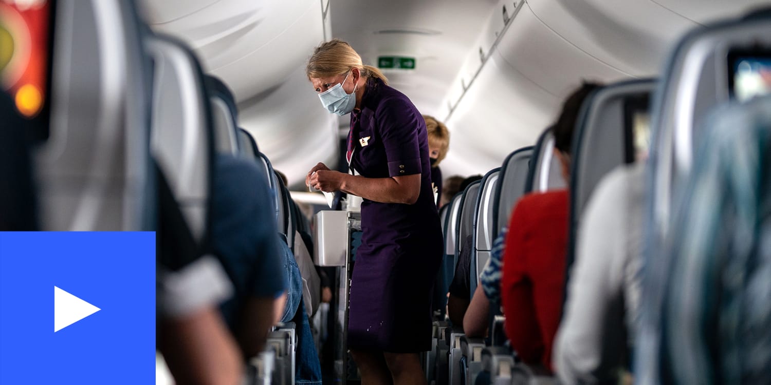 A photo of a flight attendant wearing a mask