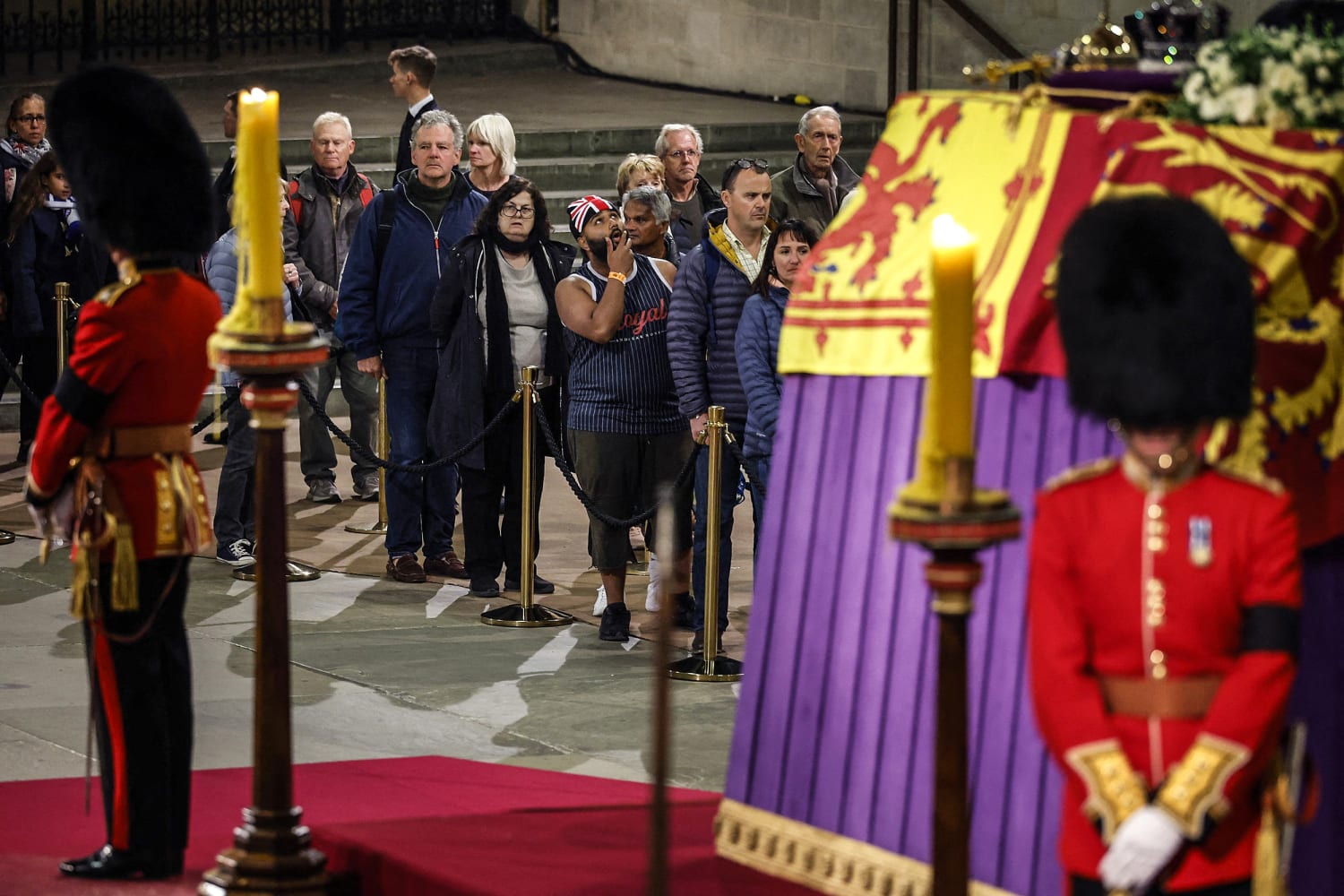 The queen's eight grandchildren hold vigil around her coffin