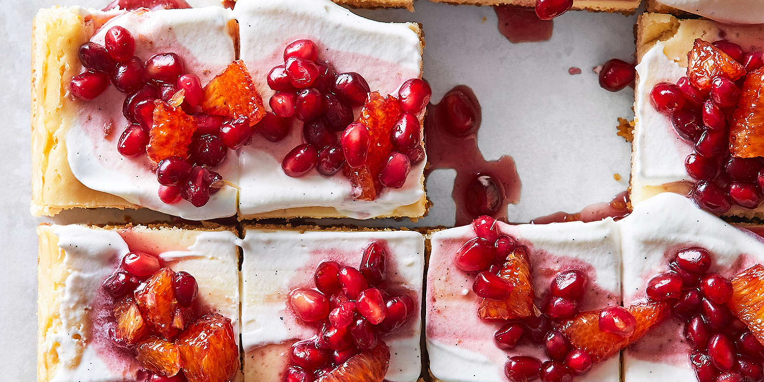 Top creamy cheesecake bars with a bright pomegranate compote