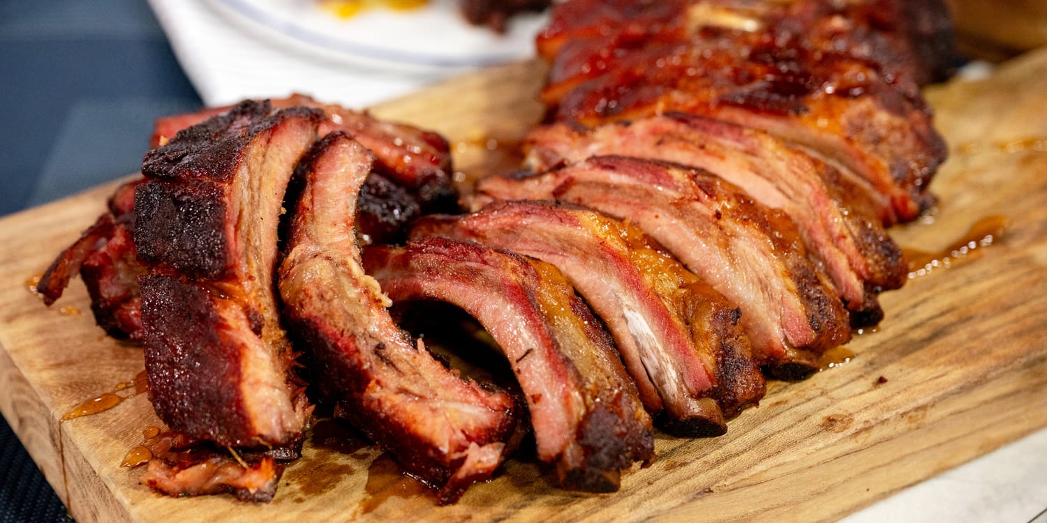 Baby back ribs with a sweet peach glaze are a sure summer crowd-pleaser