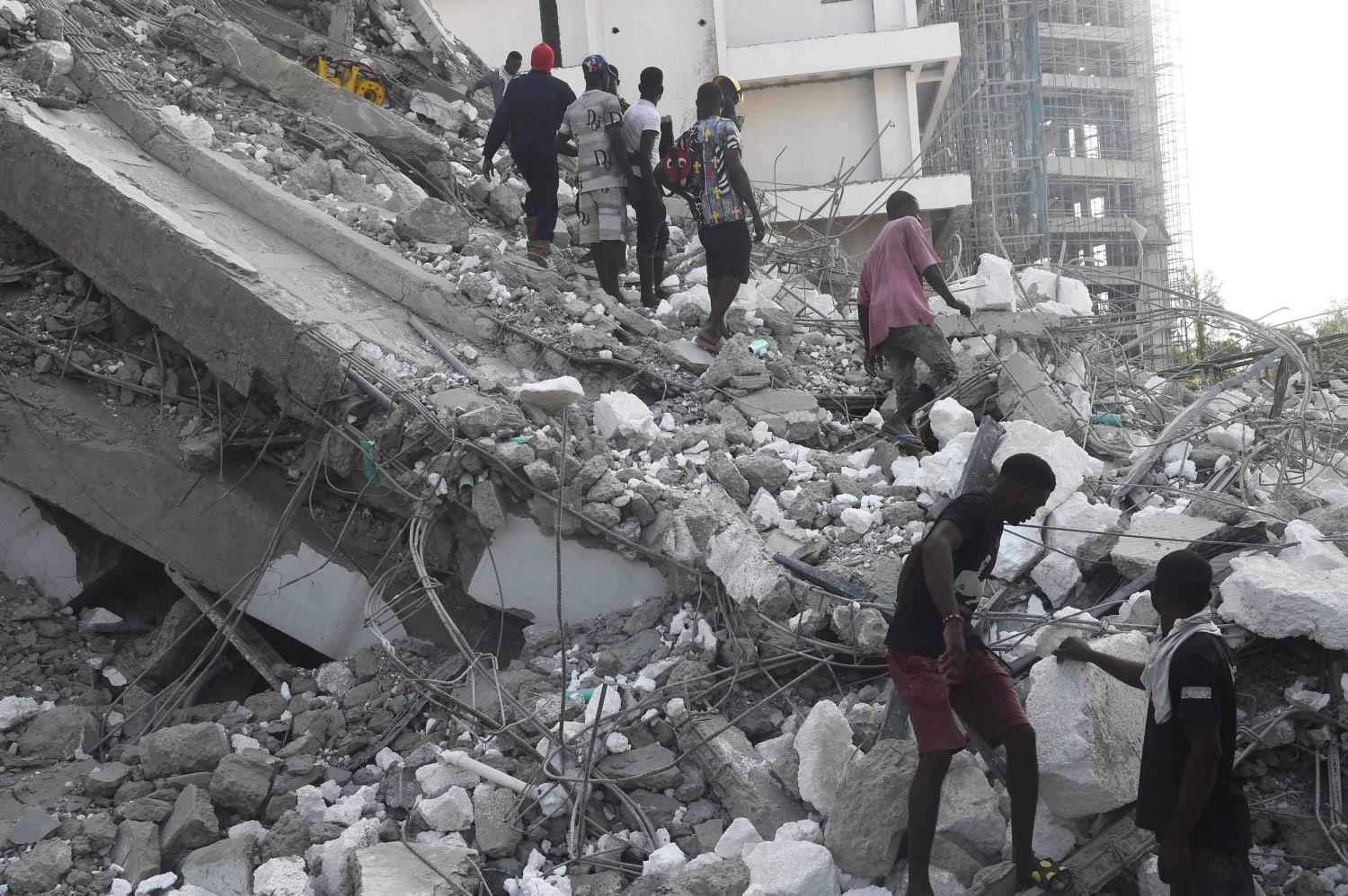 Dozens feared trapped under 21-story building collapse in Nigeria
