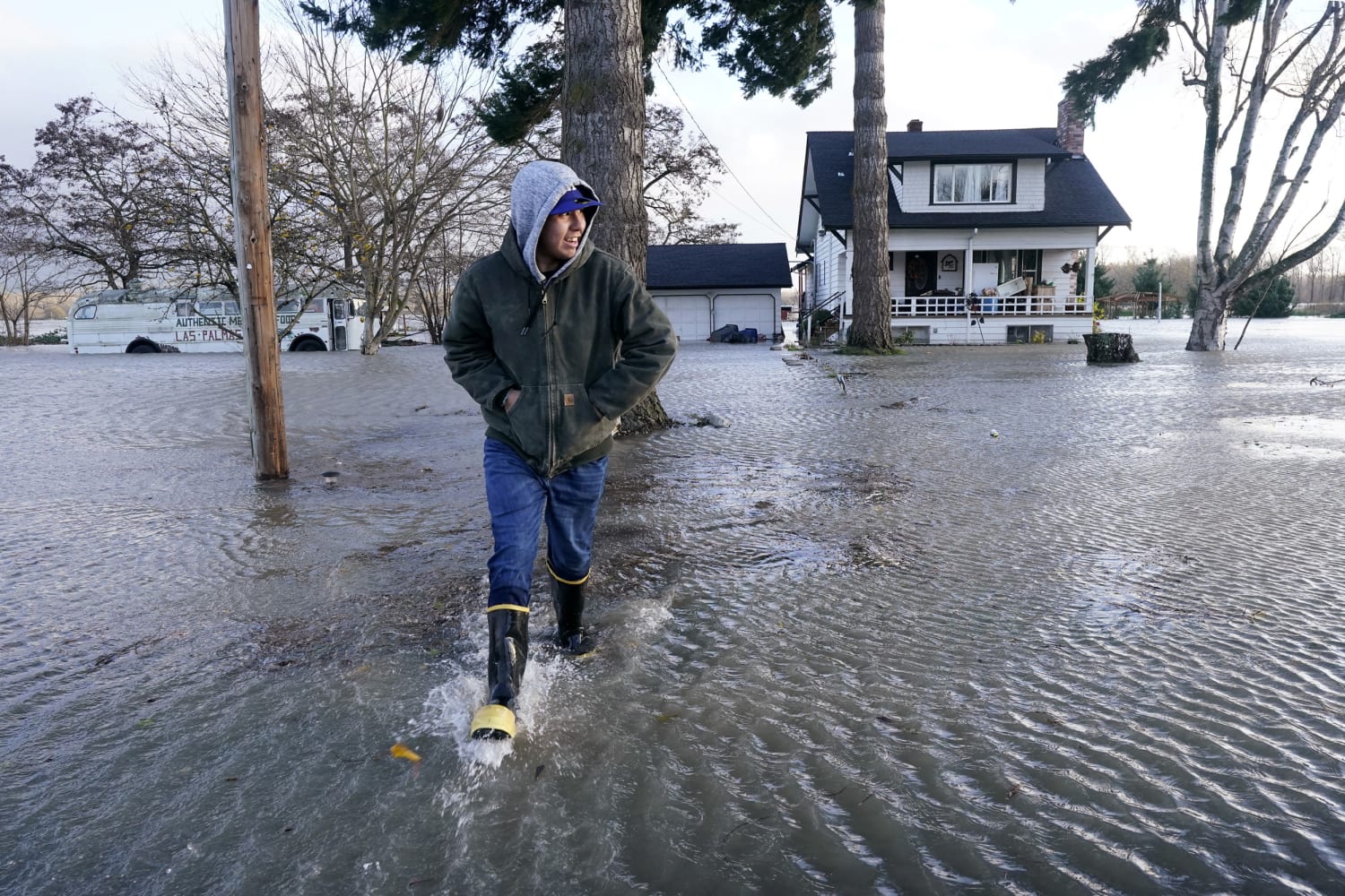 Floodwaters rush through several Pacific Northwest towns amid record rainfall