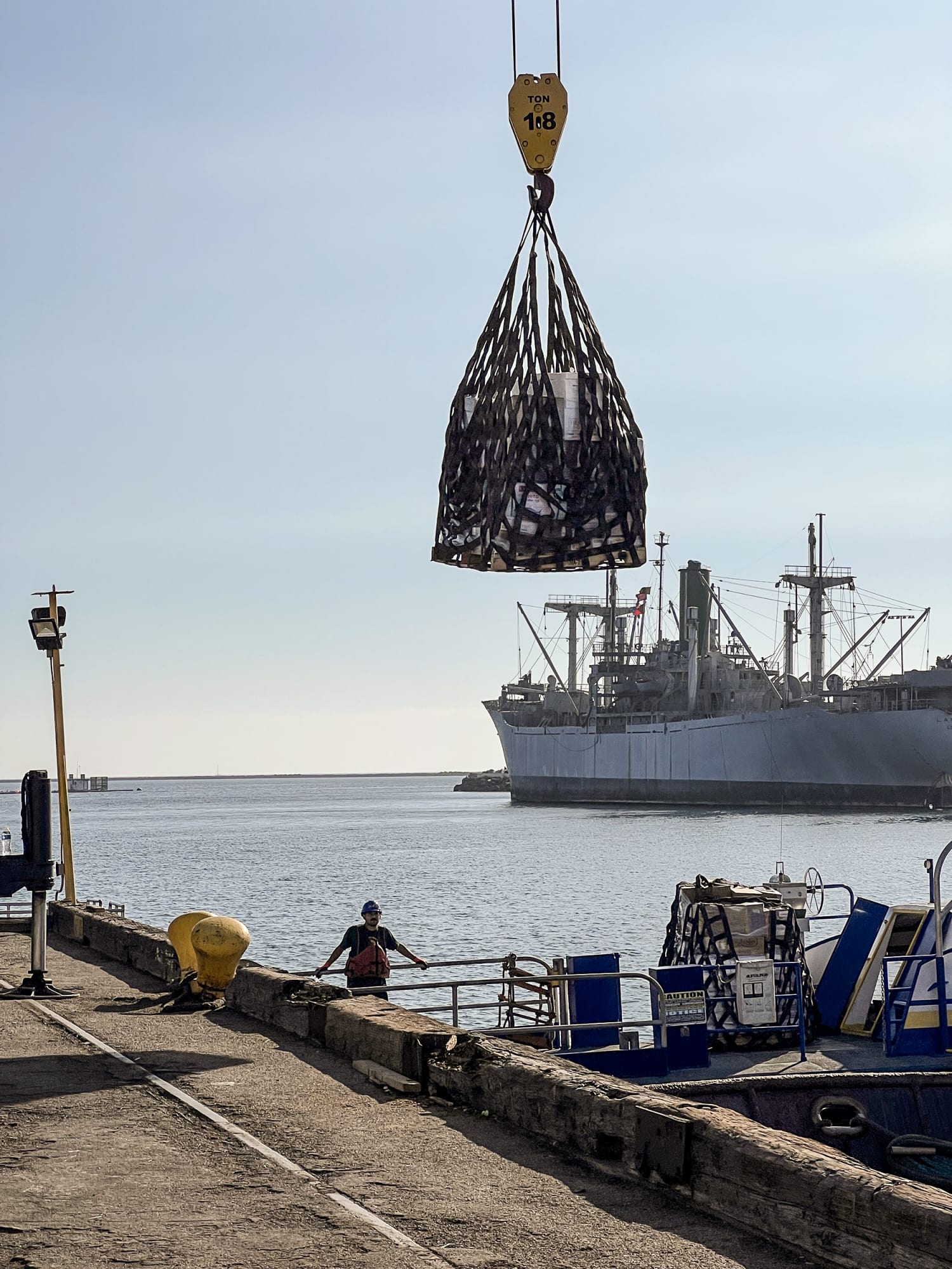 Is it a bad idea or illegal to fish near docked cargo ships? I've done it a  few times but I'm not too sure how illegal or dangerous it is. Do cargo