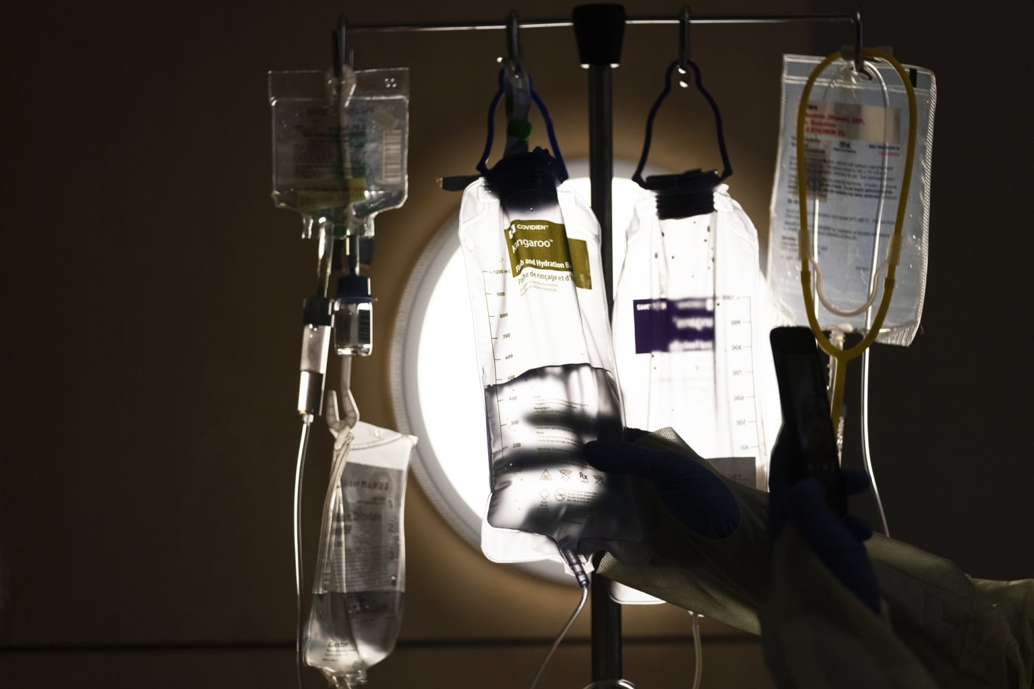 Beleaguered hospitals warn patients, push back treatments amid Covid surge