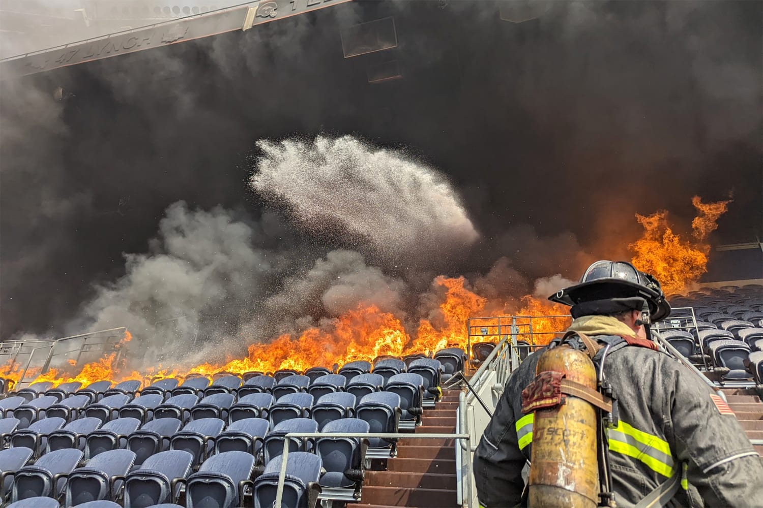 Dramatic images show fire erupting inside Denver's Mile High Stadium