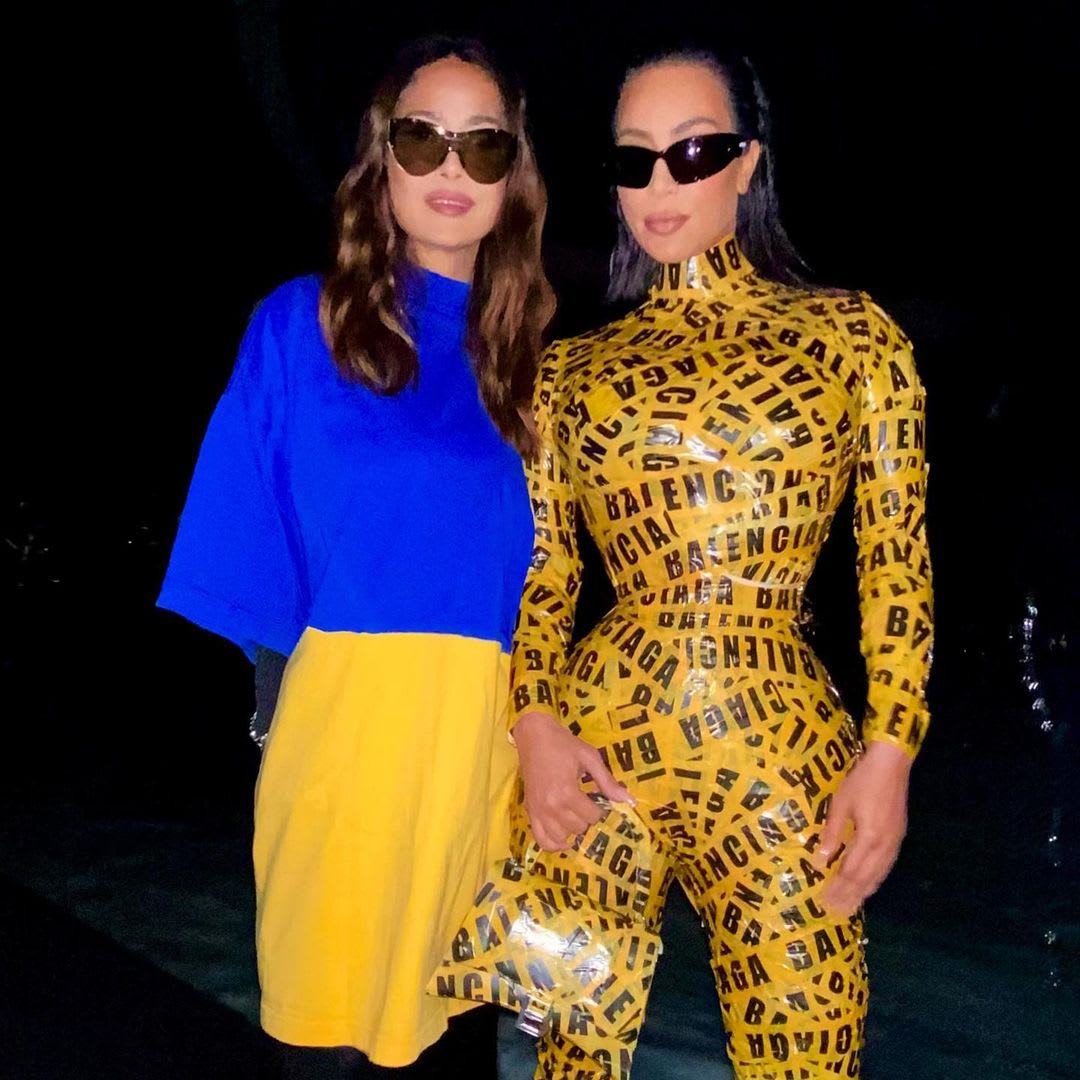 Kim Kardashian Attends Balenciaga Show in Yellow Caution Tape Catsuit