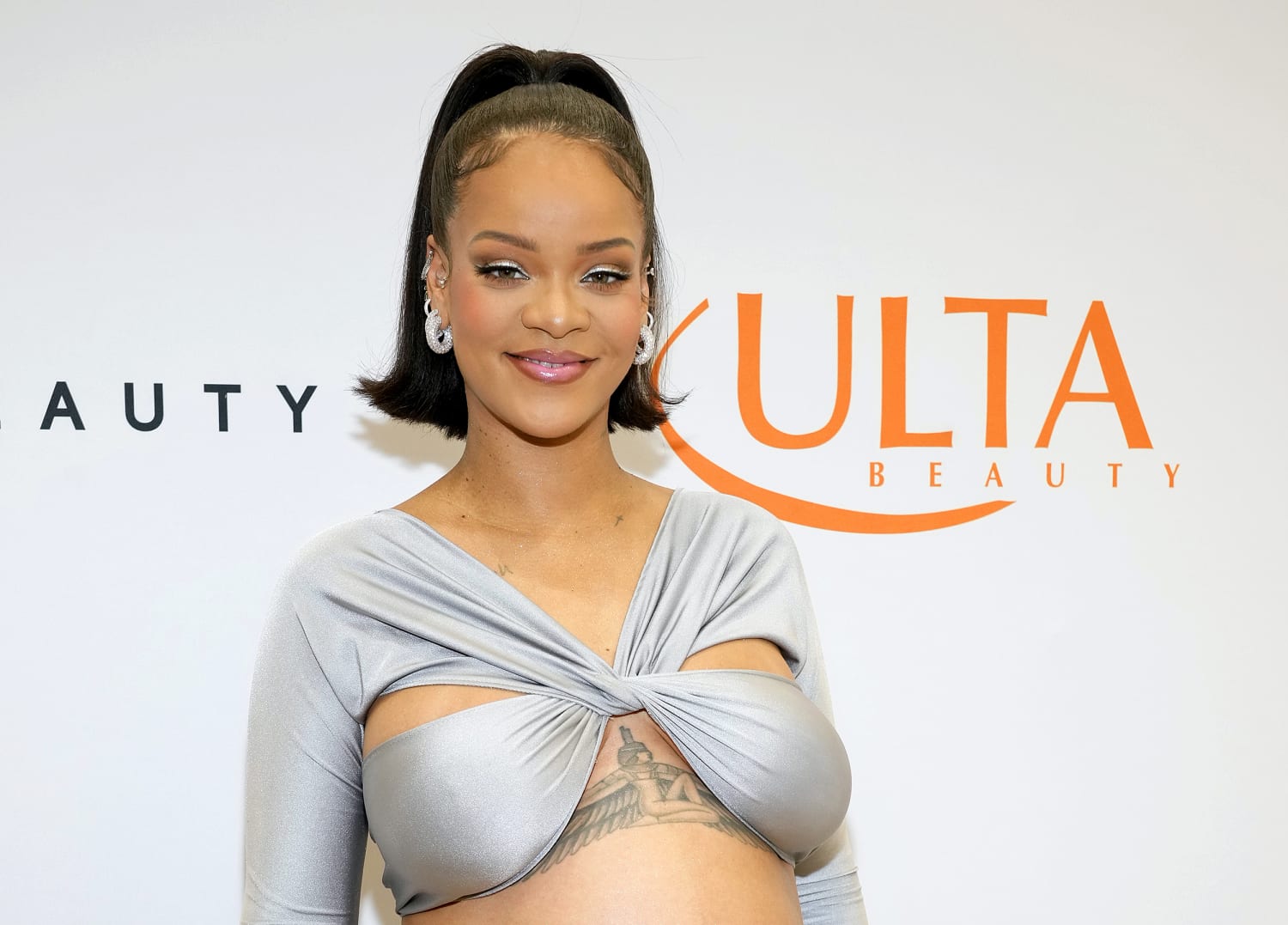 Pregnant Rihanna Sparkles in Silver for Fenty Beauty Launch at Ulta