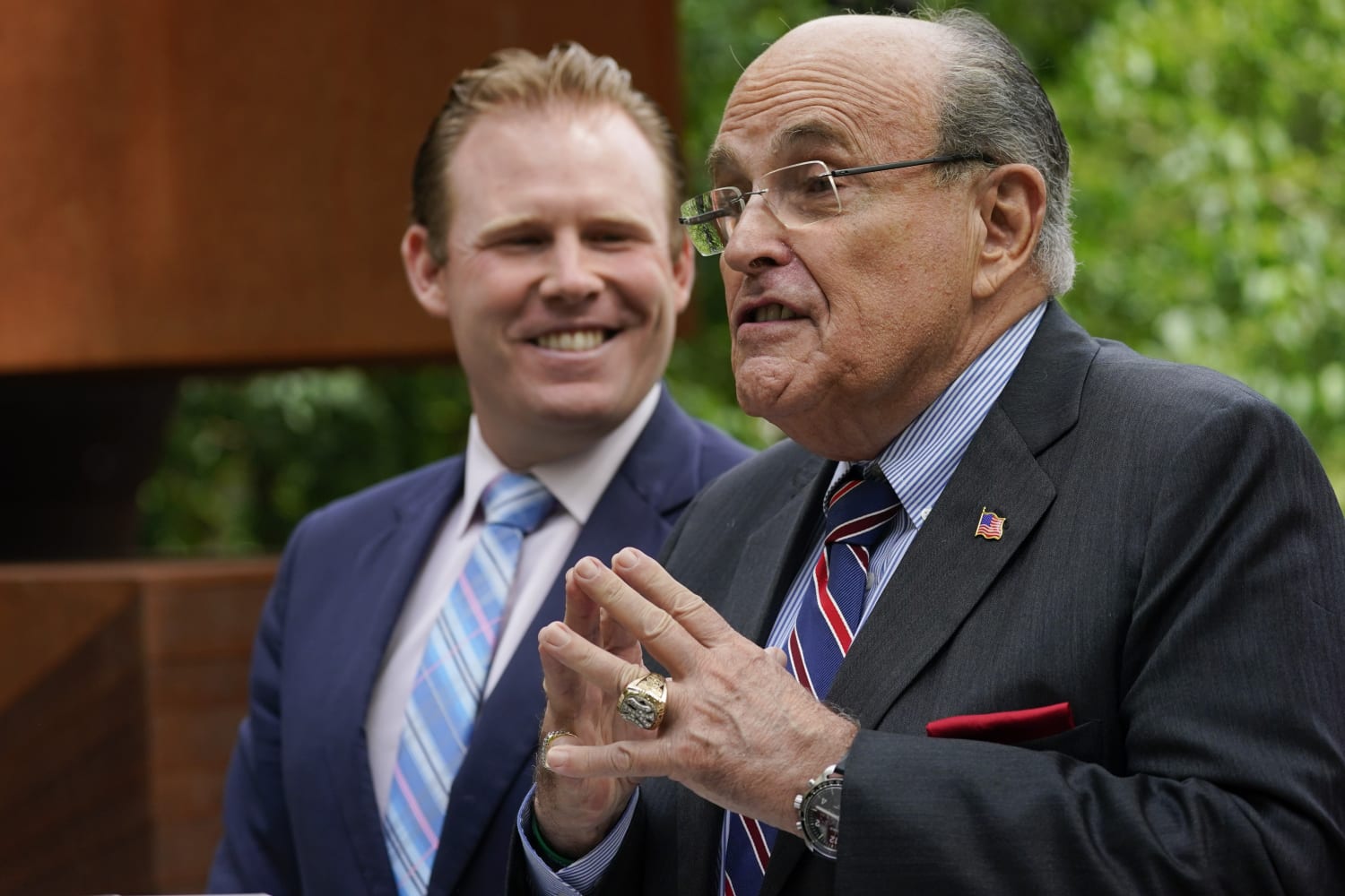 Man in custody after Rudy Giuliani 'slapped' on his back, police say