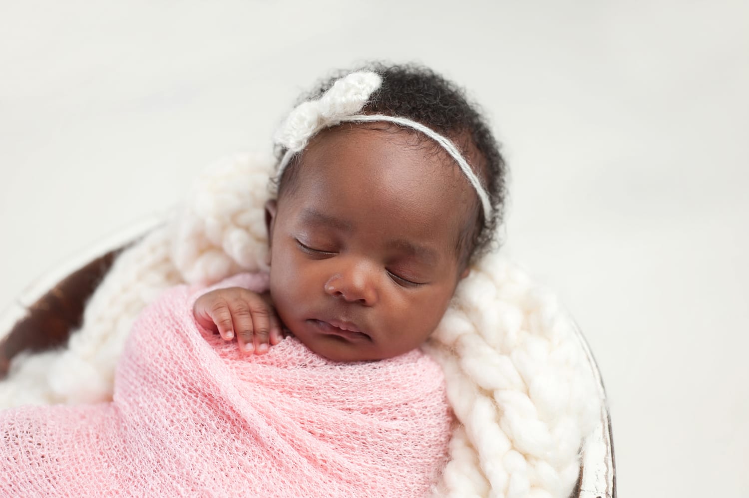 newborn baby girl with brown hair