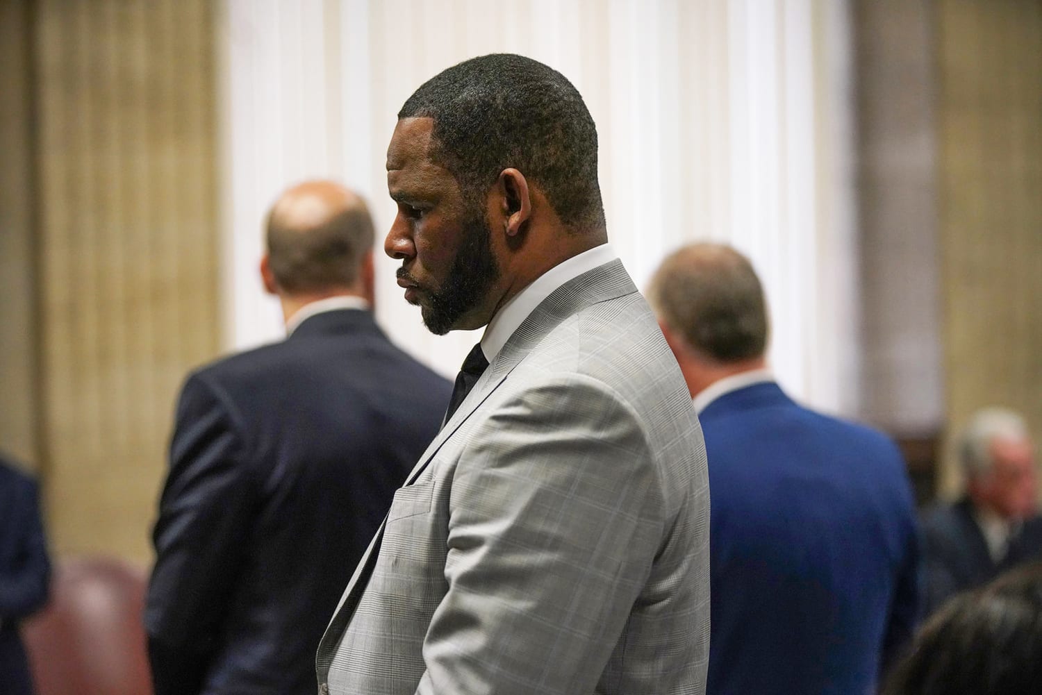 R. Kelly sexually assaulted minors and paid witnesses to cover up evidence, prosecutors say as his trial begins