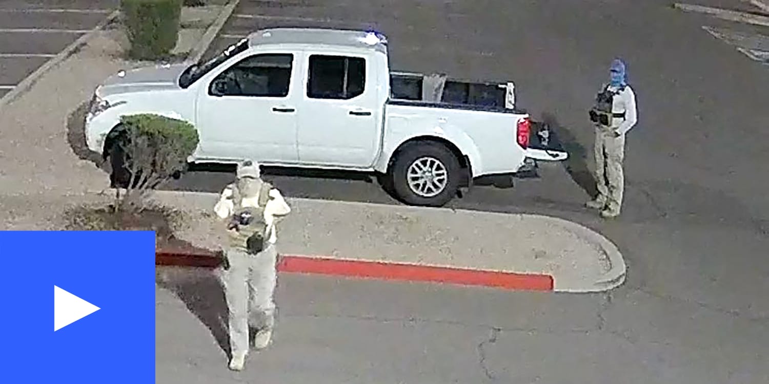 Image of armed ballot watchers in Arizona