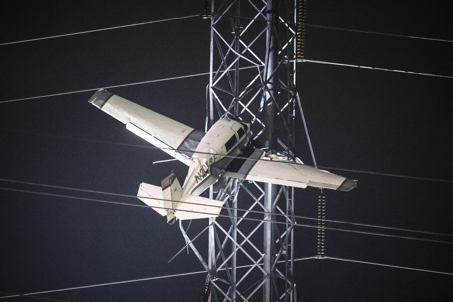 2 rescued from small plane as it dangled 100 feet in the air after hitting a power tower