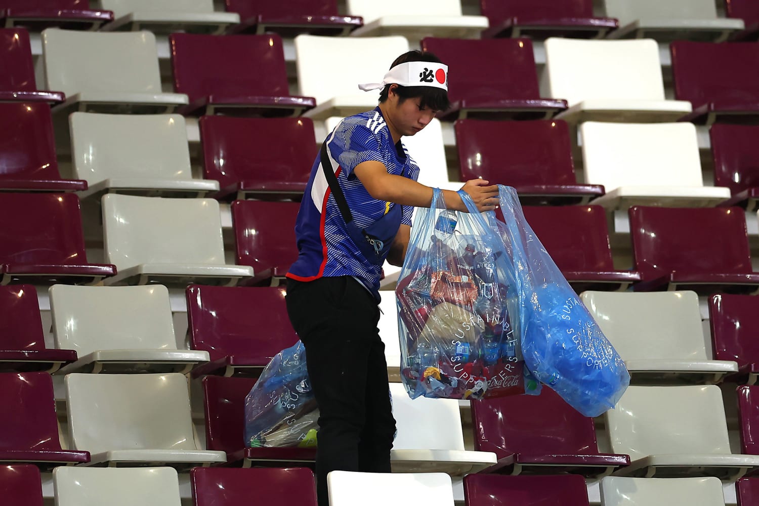 Japanese fans clean World Cup stadium after win against Germany