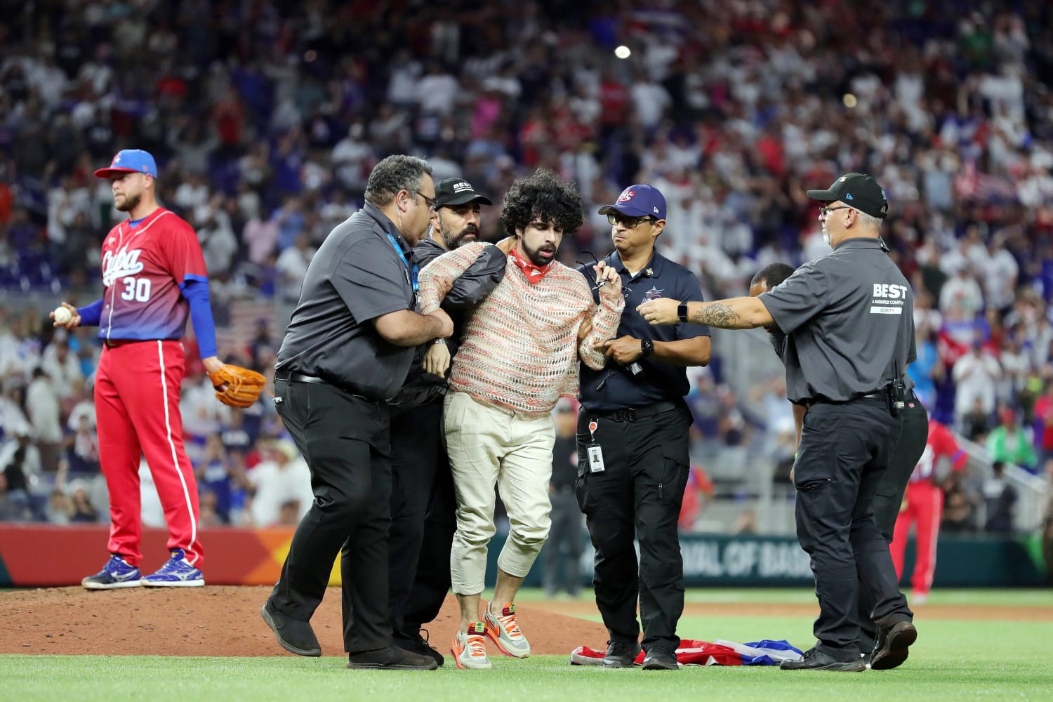 Protesters gather in Miami and run onto the field at Cuba-U.S. World Baseball Classic semifinal