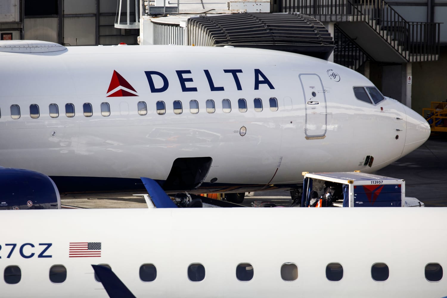 Man detained at LAX and acused of opening emergency exit on Delta plane