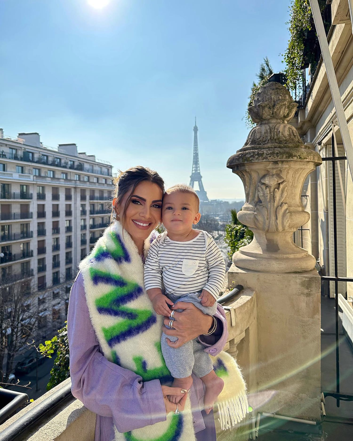 Influencer Camila Coelho Poses With Son Kai On Balcony Ledge