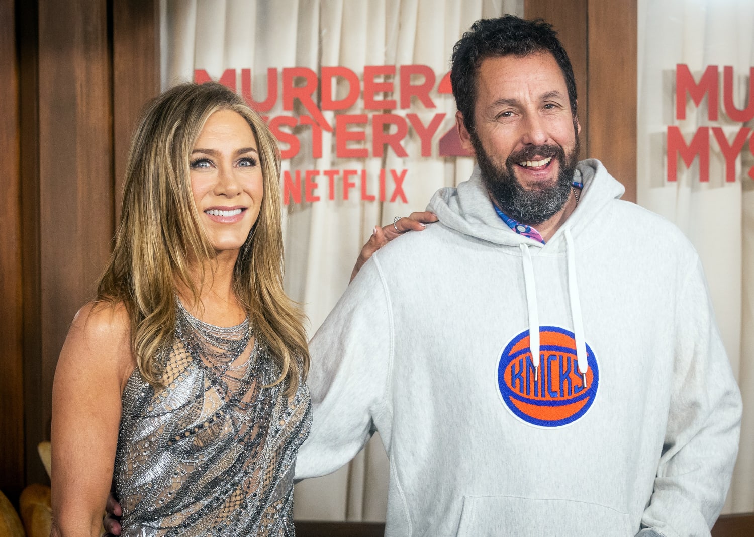 Jennifer Aniston stuns on the red carpet with Adam Sandler