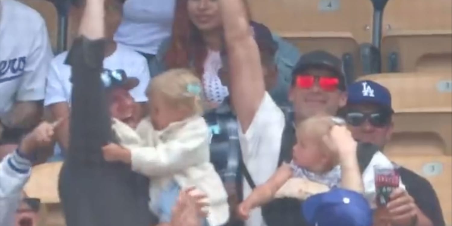 Dad With Baby Strapped To Chest Holding Beer Catches Foul Ball At