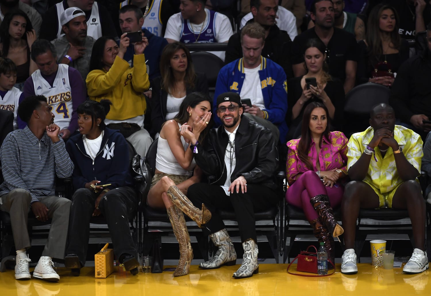 Bad Bunny and Kendall Jenner coordinate shoes at Lakers game