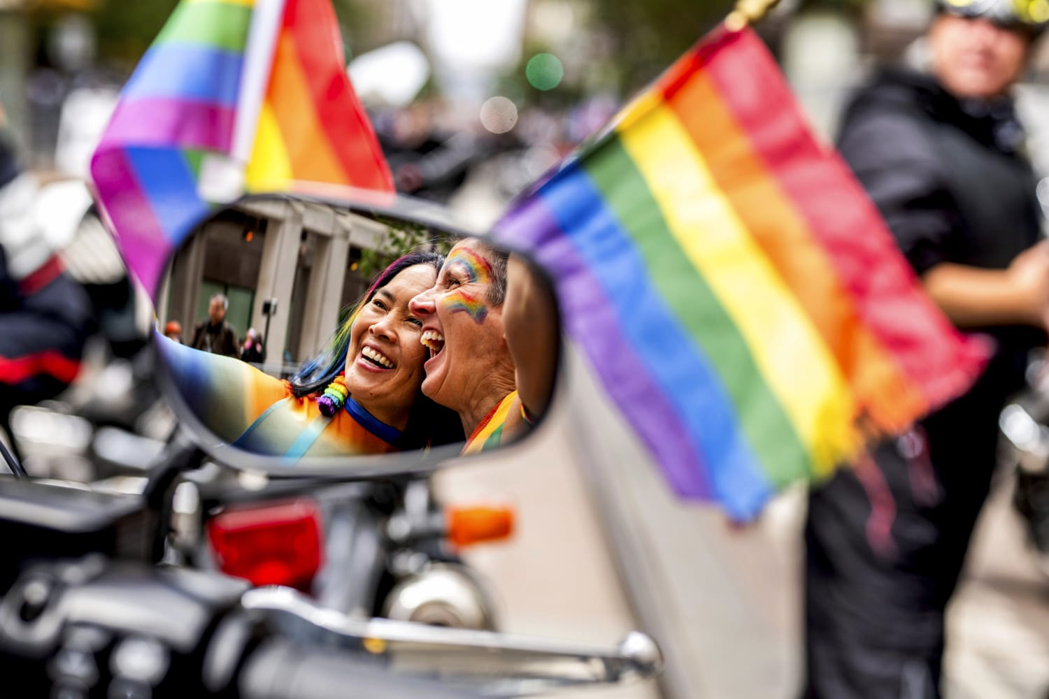 Party and protest mix as LGBTQ pride parades roll from coast to coast