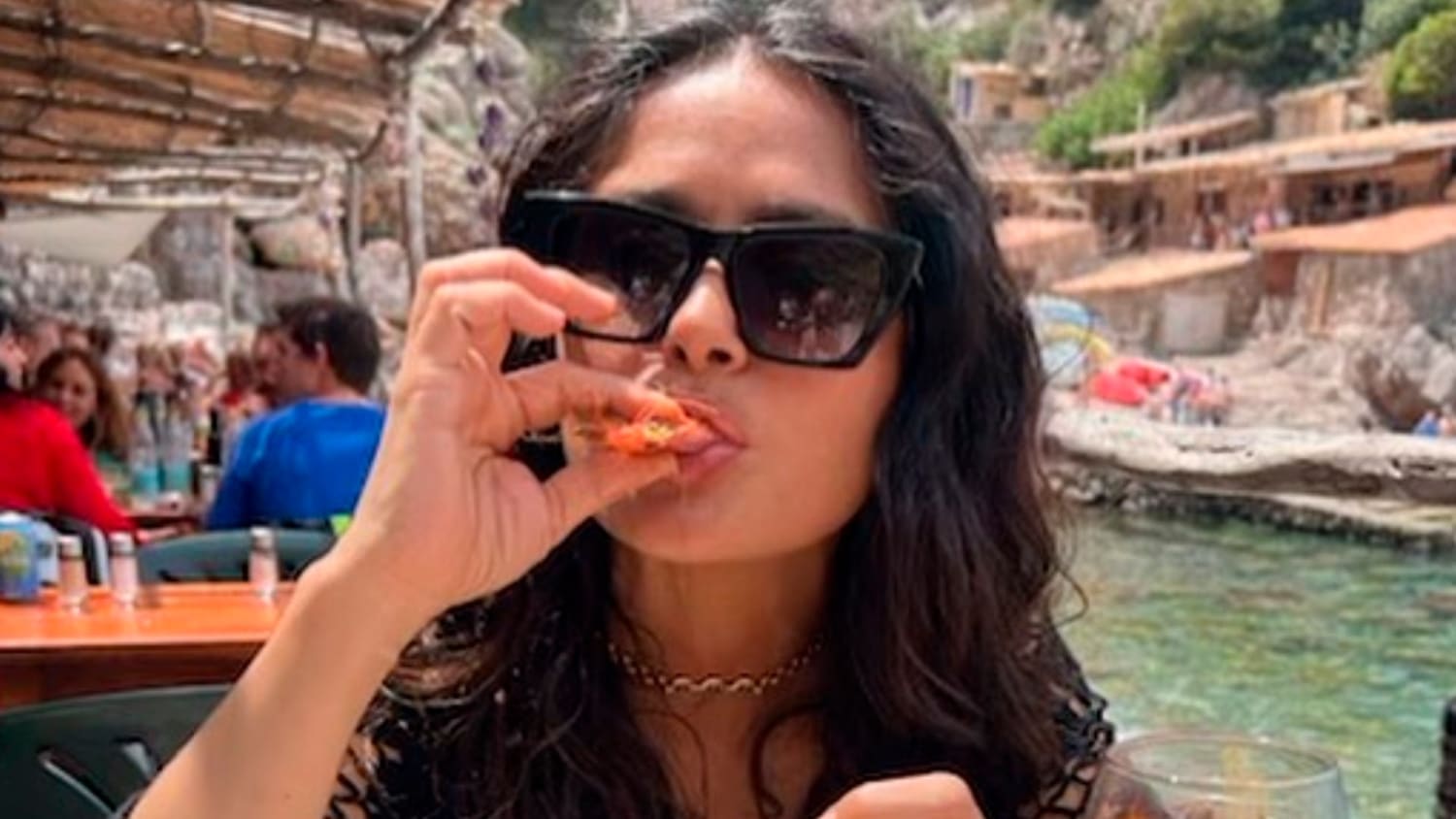 Salma Hayek shows off her weird way of eating shrimp