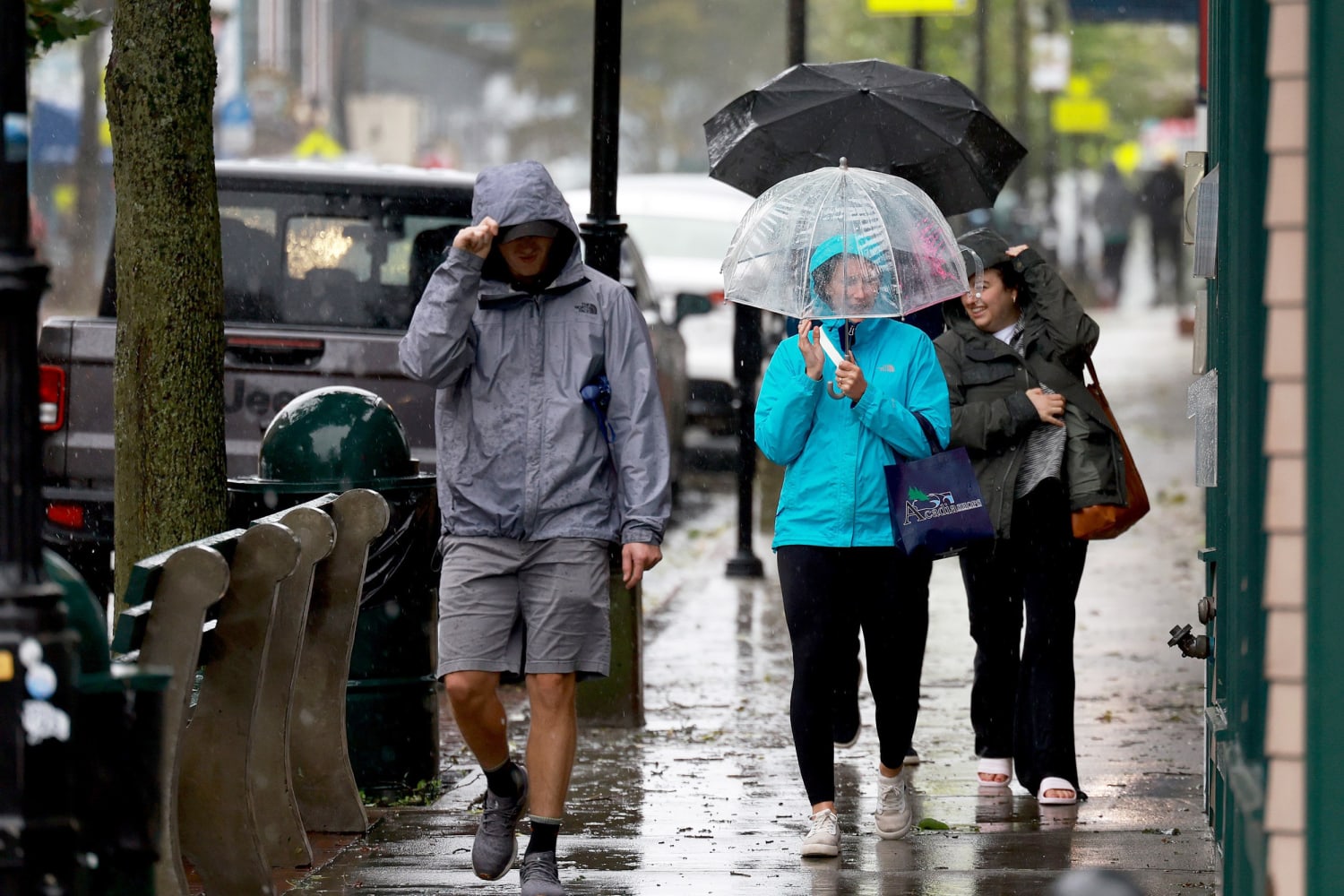 people walking in the rain