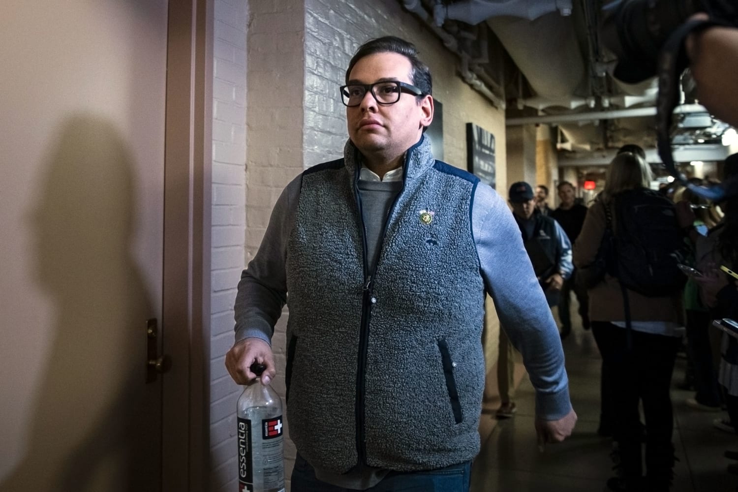 Rep. George Santos pleads not guilty to new charges as judge sets Sept. trial