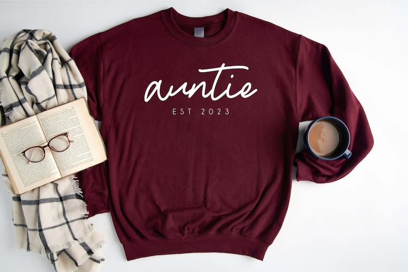 https://media-cldnry.s-nbcnews.com/image/upload/rockcms/2023-10/DIFFBOT-Custom-Auntie-Est-Sweatshirt-Auntie-Gifts--Aunt-Gift-Aunt-Shirt-Christmas-Gift-Auntie-Mothers-Day-Sweatshirt-Mothers-Day-Gift-b1e4d1.jpg