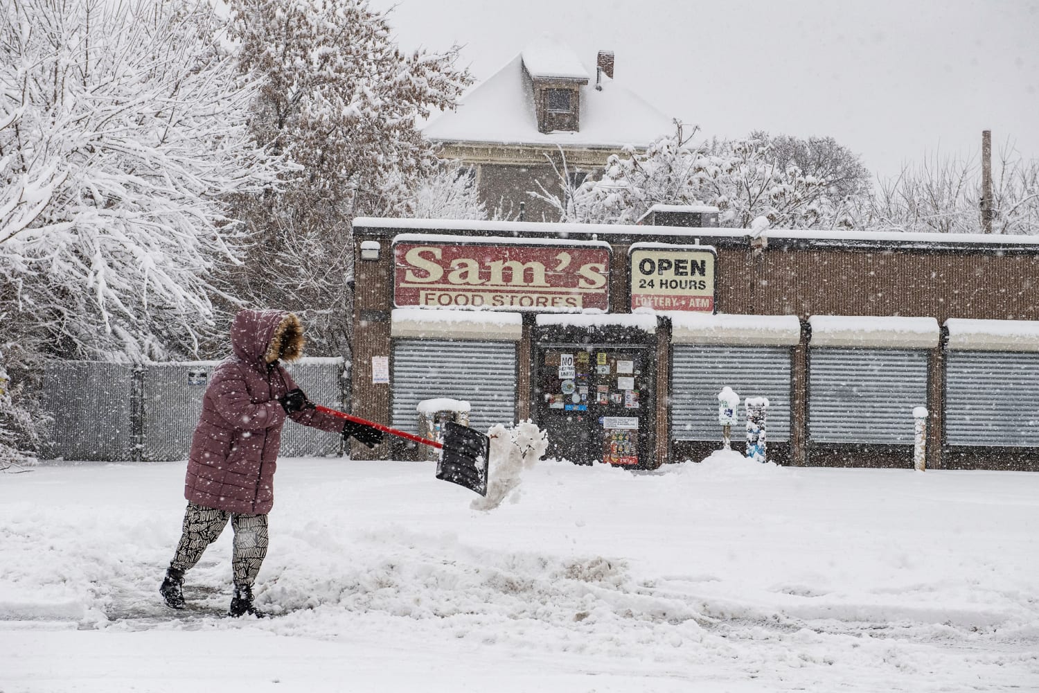Major winter storms bring snow, ice and travel hazards to both US coasts