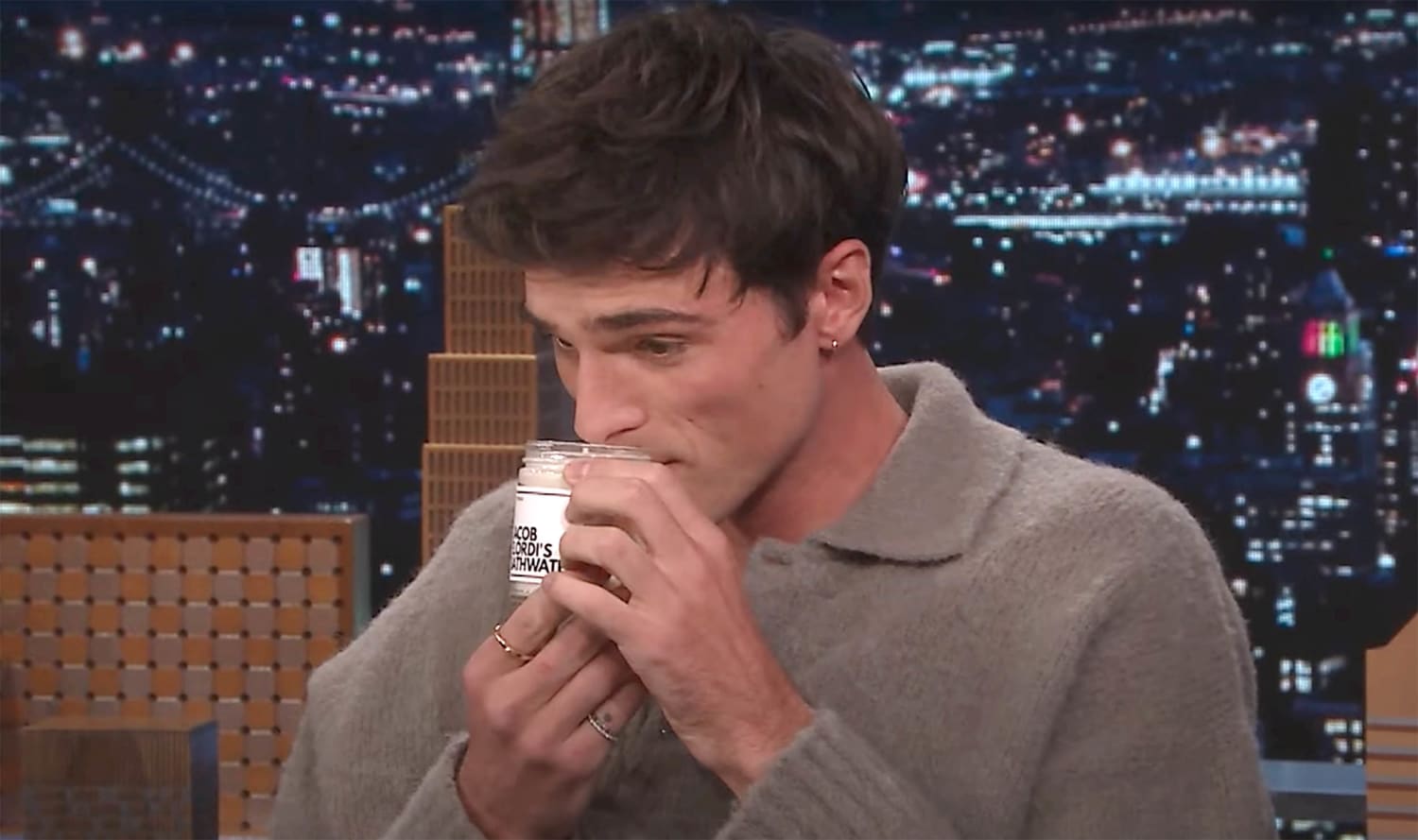 An aerial view of a field. A road runs through the upper right corner.