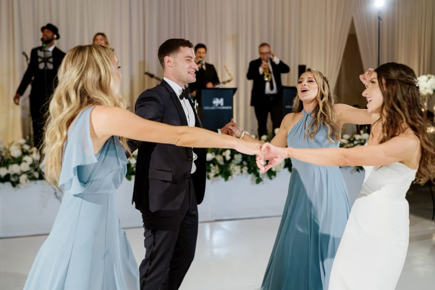 After their mom died, 2 sisters stepped in to dance with their brother on his wedding day