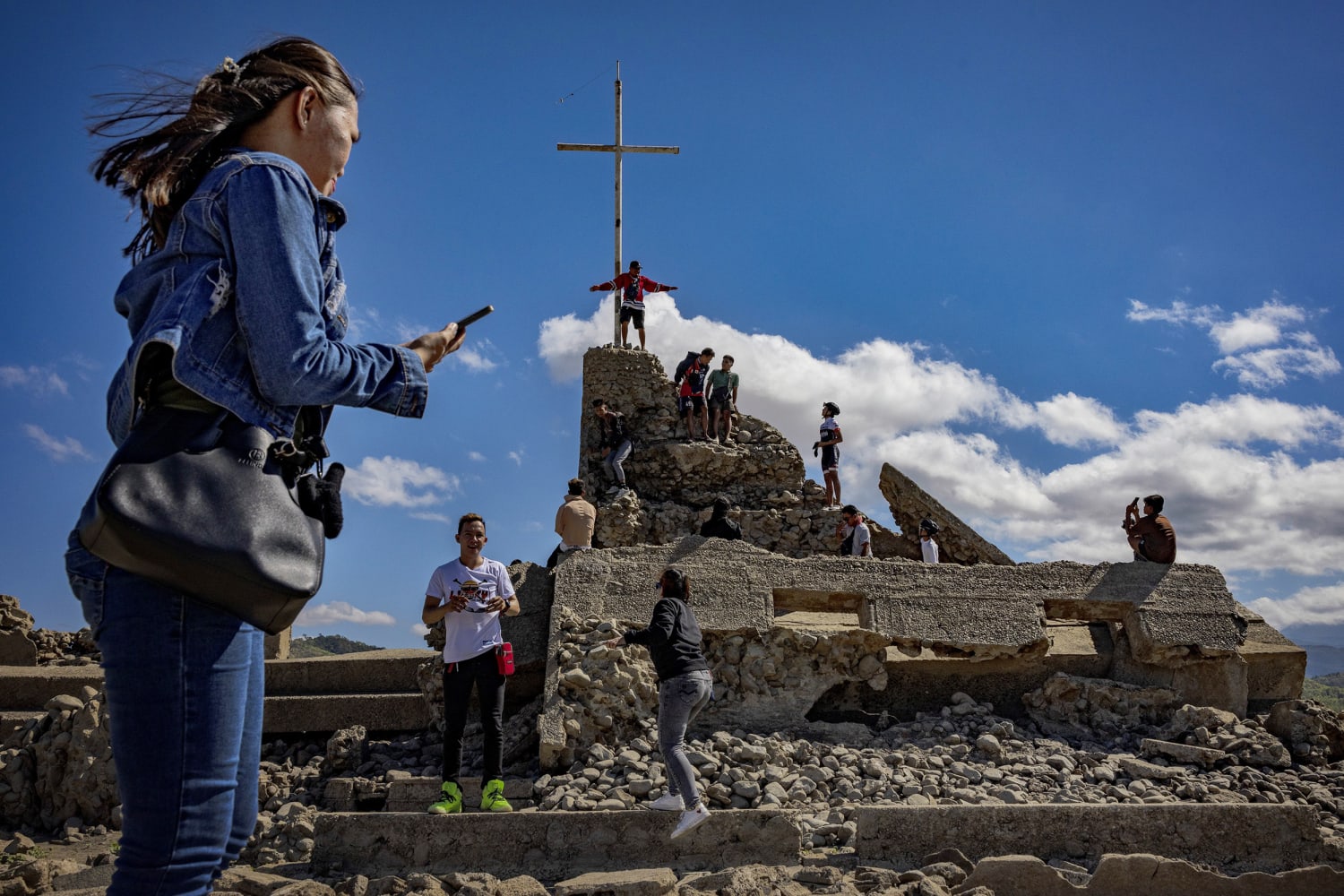 Dry dam in the Philippines uncovers ancient town, attracting visitors ...