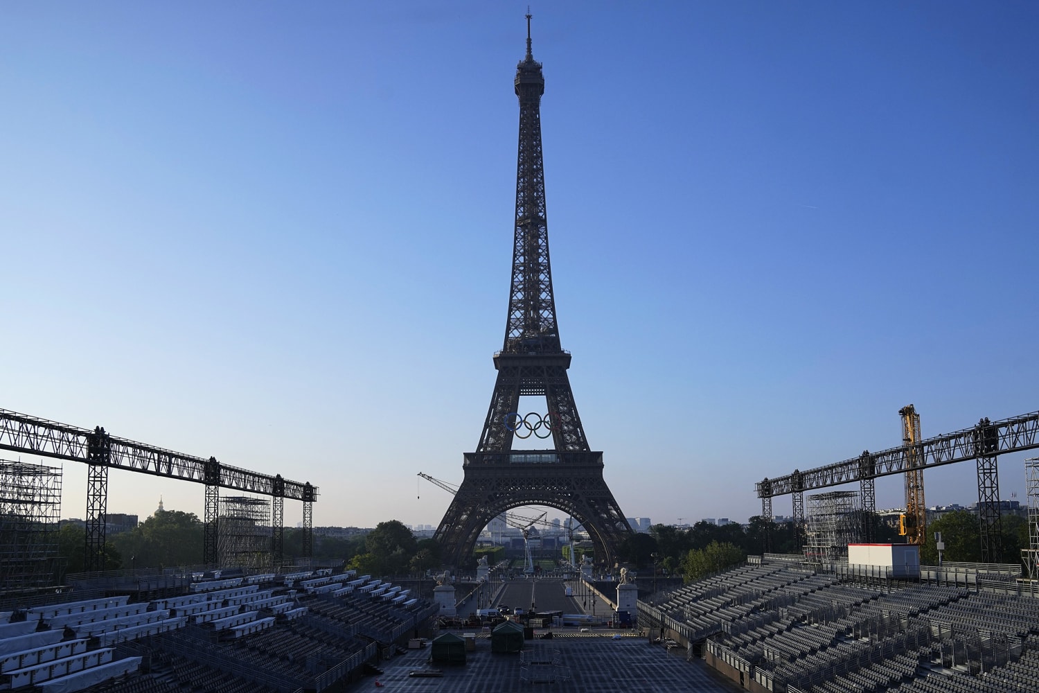 Paris Olympics rings mounted on the Eiffel Tower