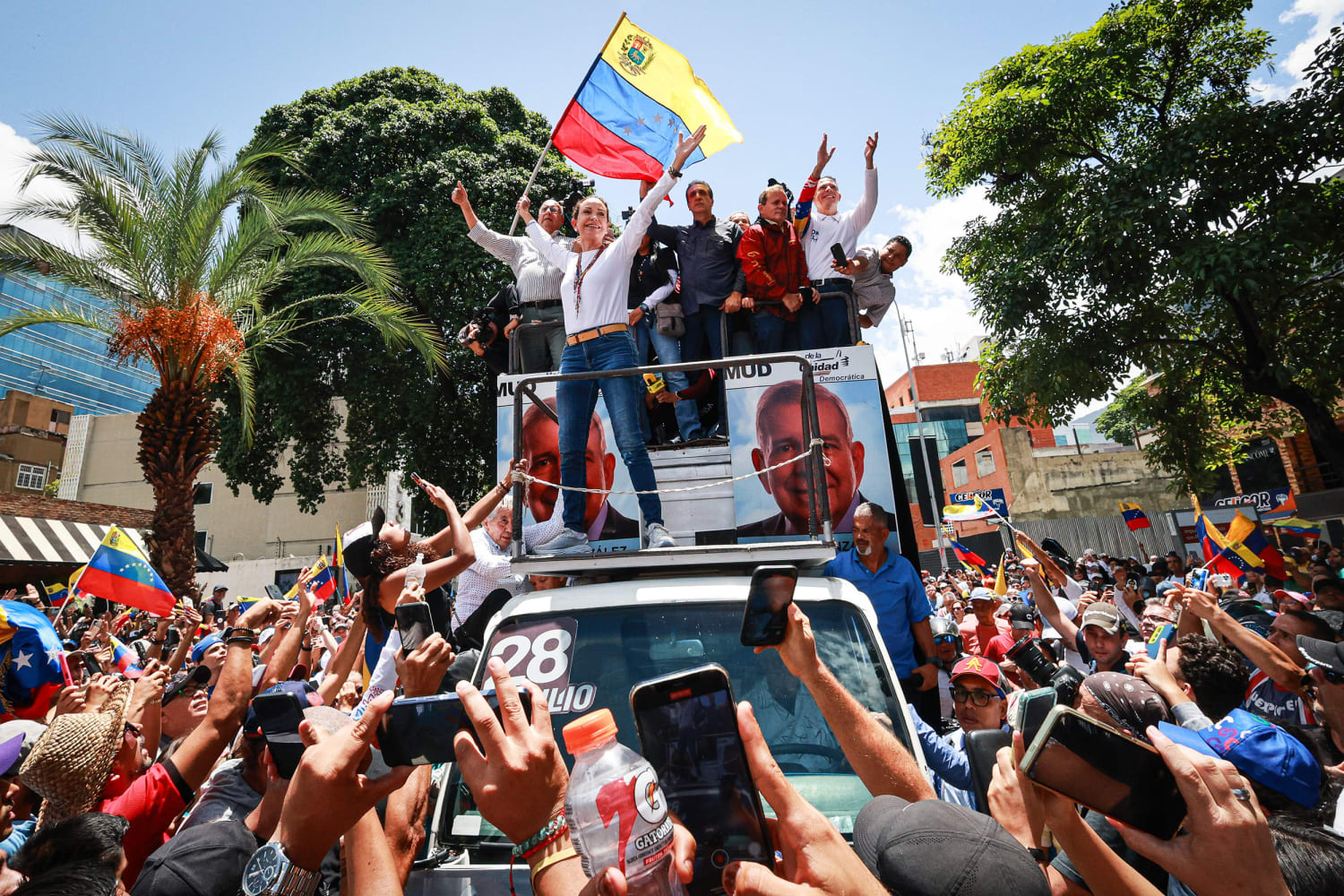 Venezuelans march over contested election; number of detained rises