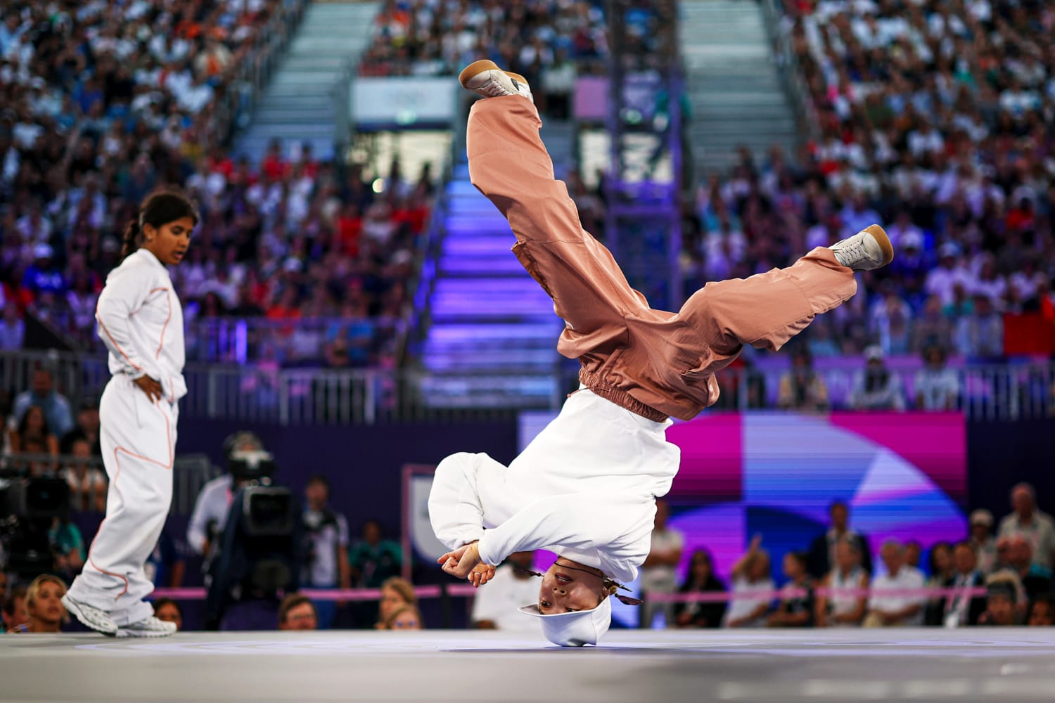 Olympic breakdancing competition showing athletes in action at Paris 2024