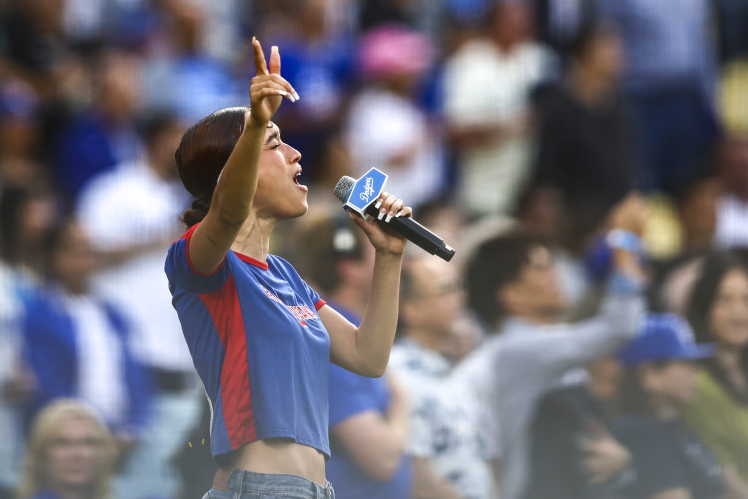 Singer Nezza, at Dodger Stadium sings national anthem in Spanish in protest of L.A. immigration raids